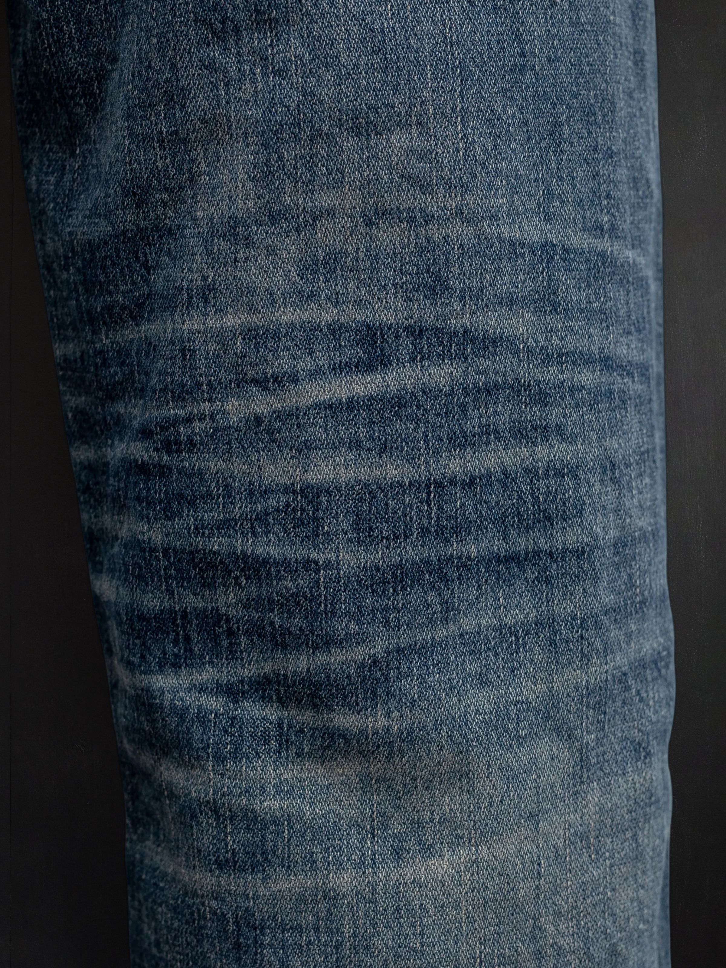 Nudie Jeans Rad Rufus Sand Tracks, close-up showing the honeycomb wear marks behind the knee.