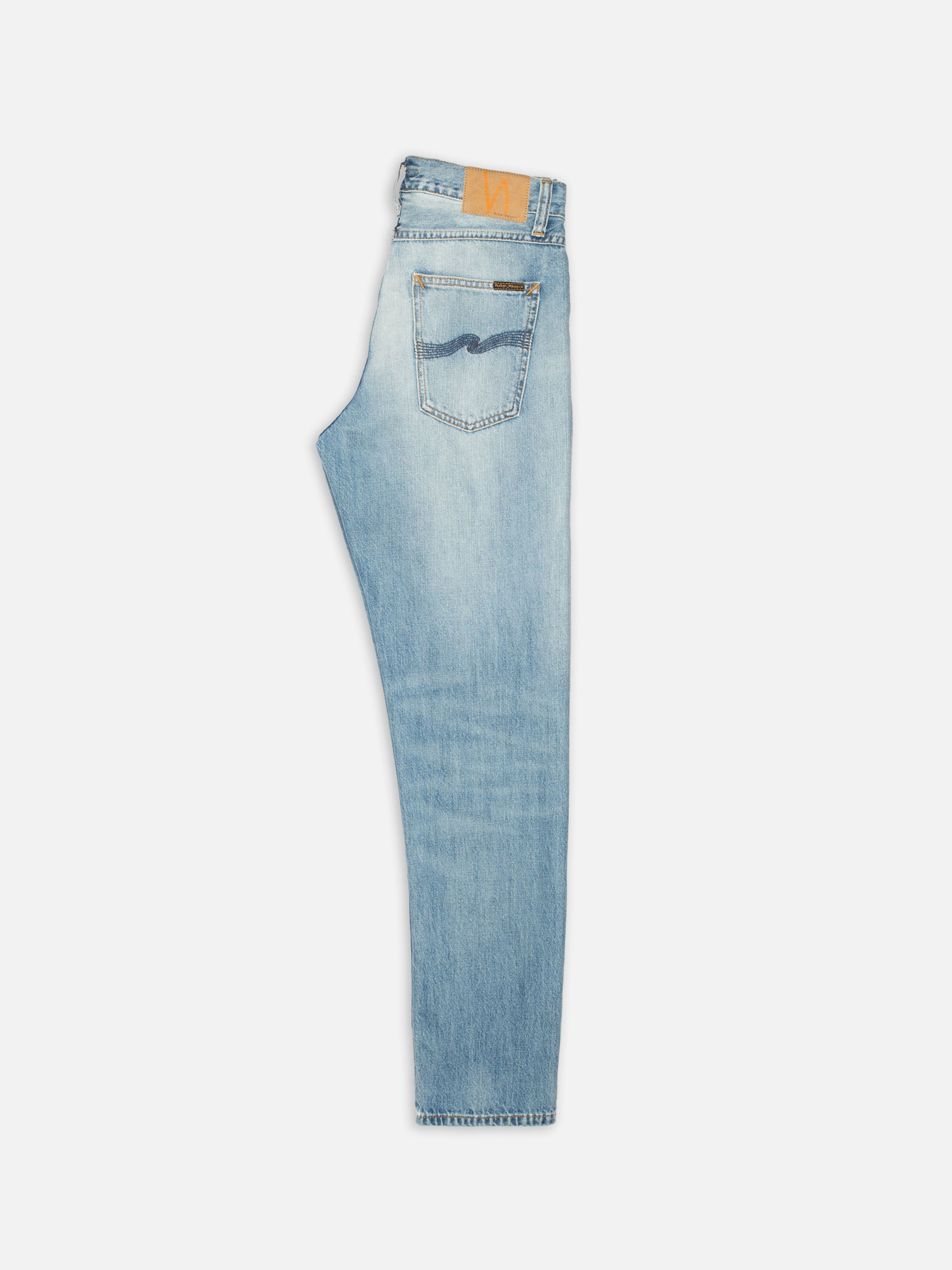 Nudie Jeans Steady Eddie II Washed Up, men's regular tapered jeans, laid flat to show the side profile and back pocket.