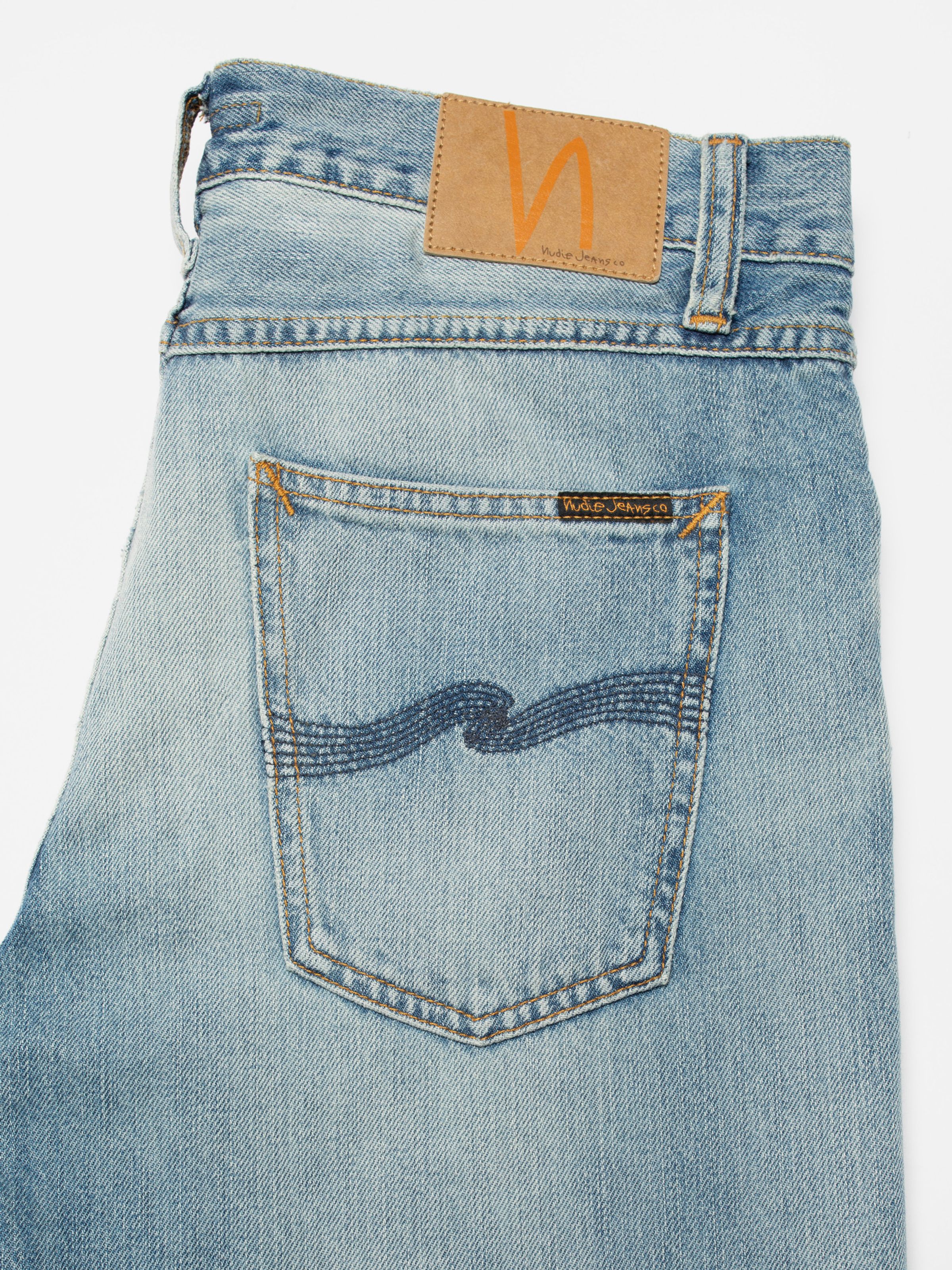 Nudie Jeans Steady Eddie II Washed Up, men's regular tapered jeans, showing a close-up of the back pocket and jacron patch.