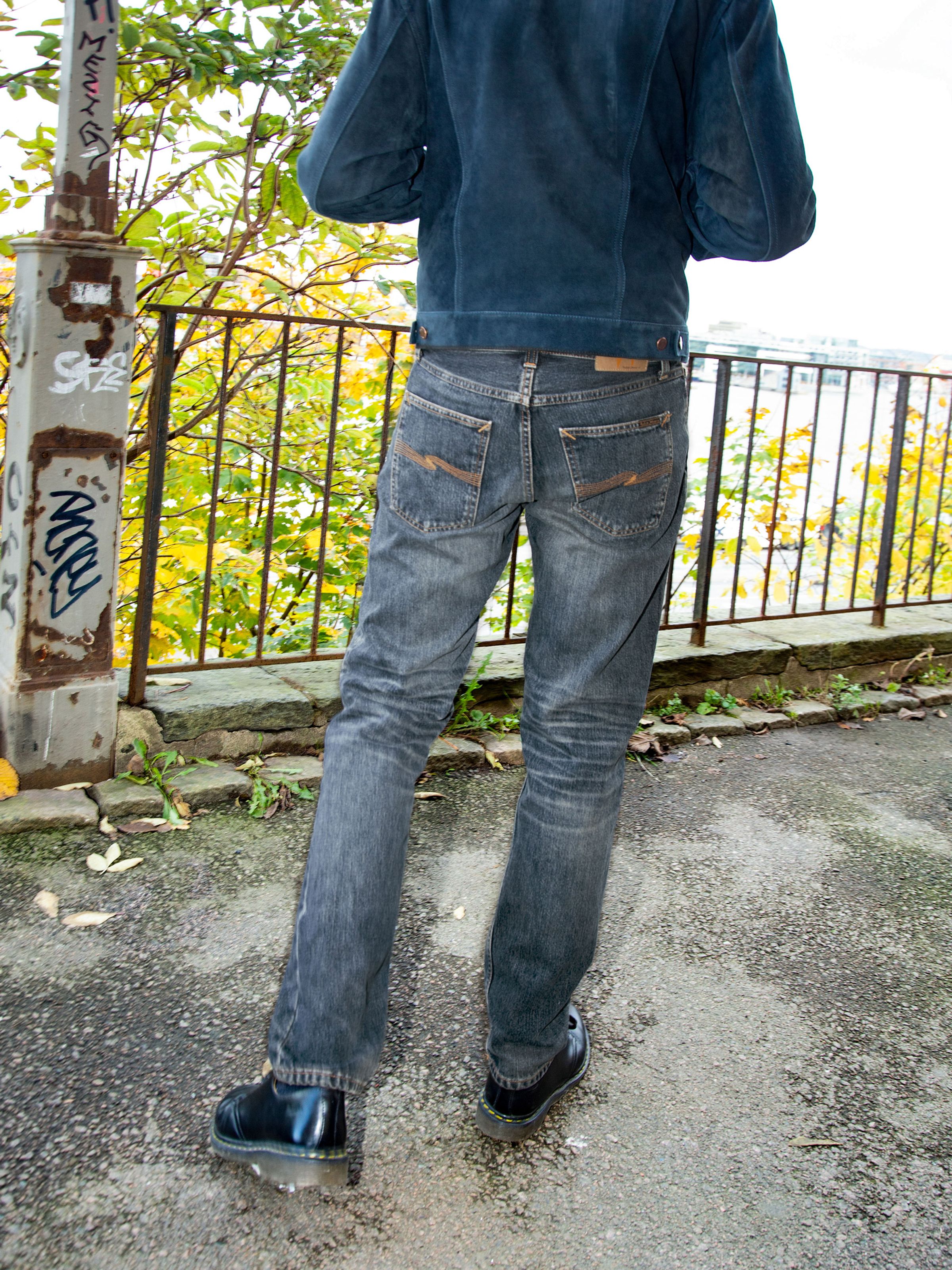 Nudie Jeans Gritty Jackson Sand Tracks, men's regular fit jeans shown from the back on a model.