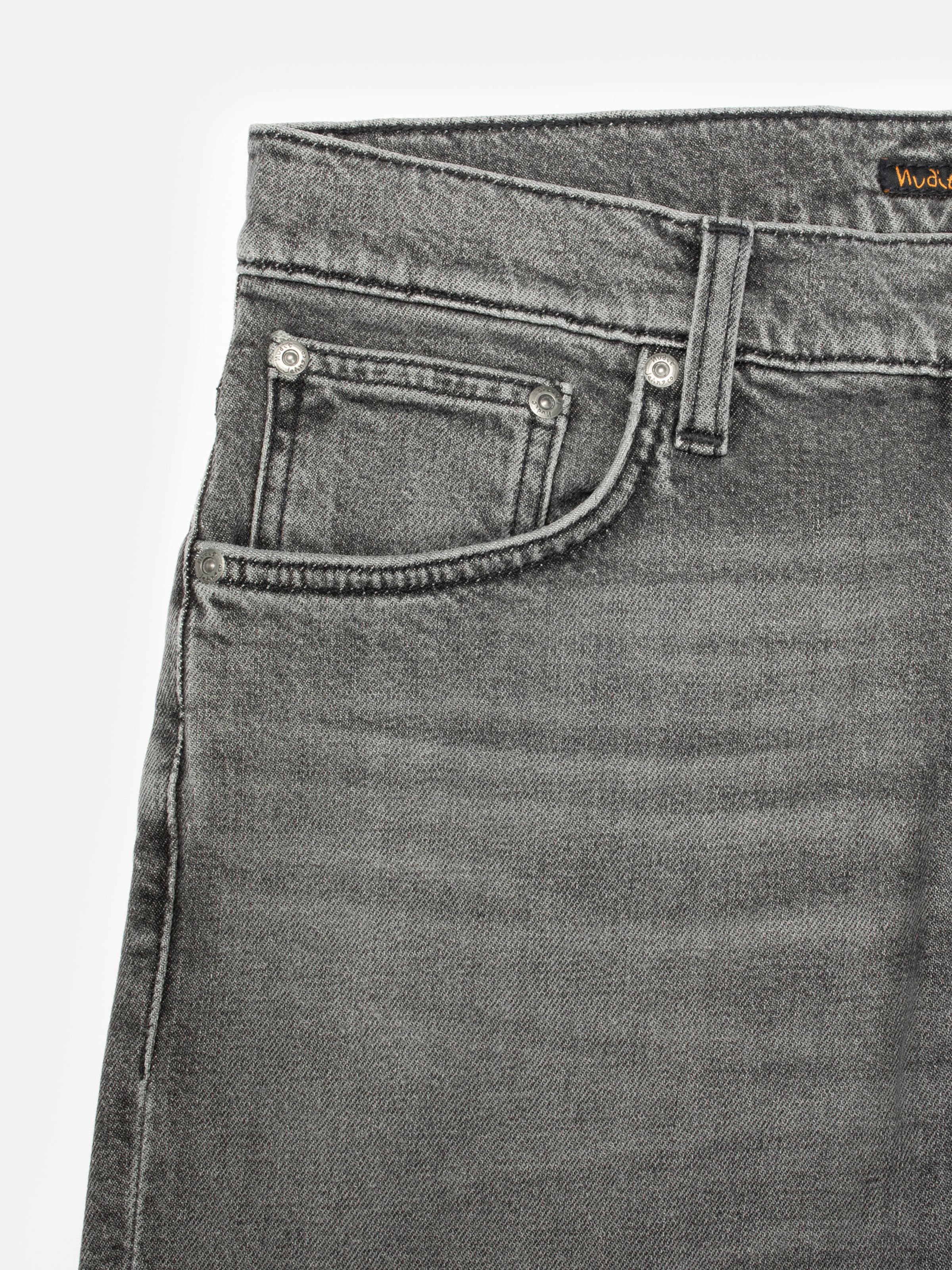 Nudie Jeans Grim Tim Cloud Grey, men's slim fit jeans, showing a close-up of the front pocket area.