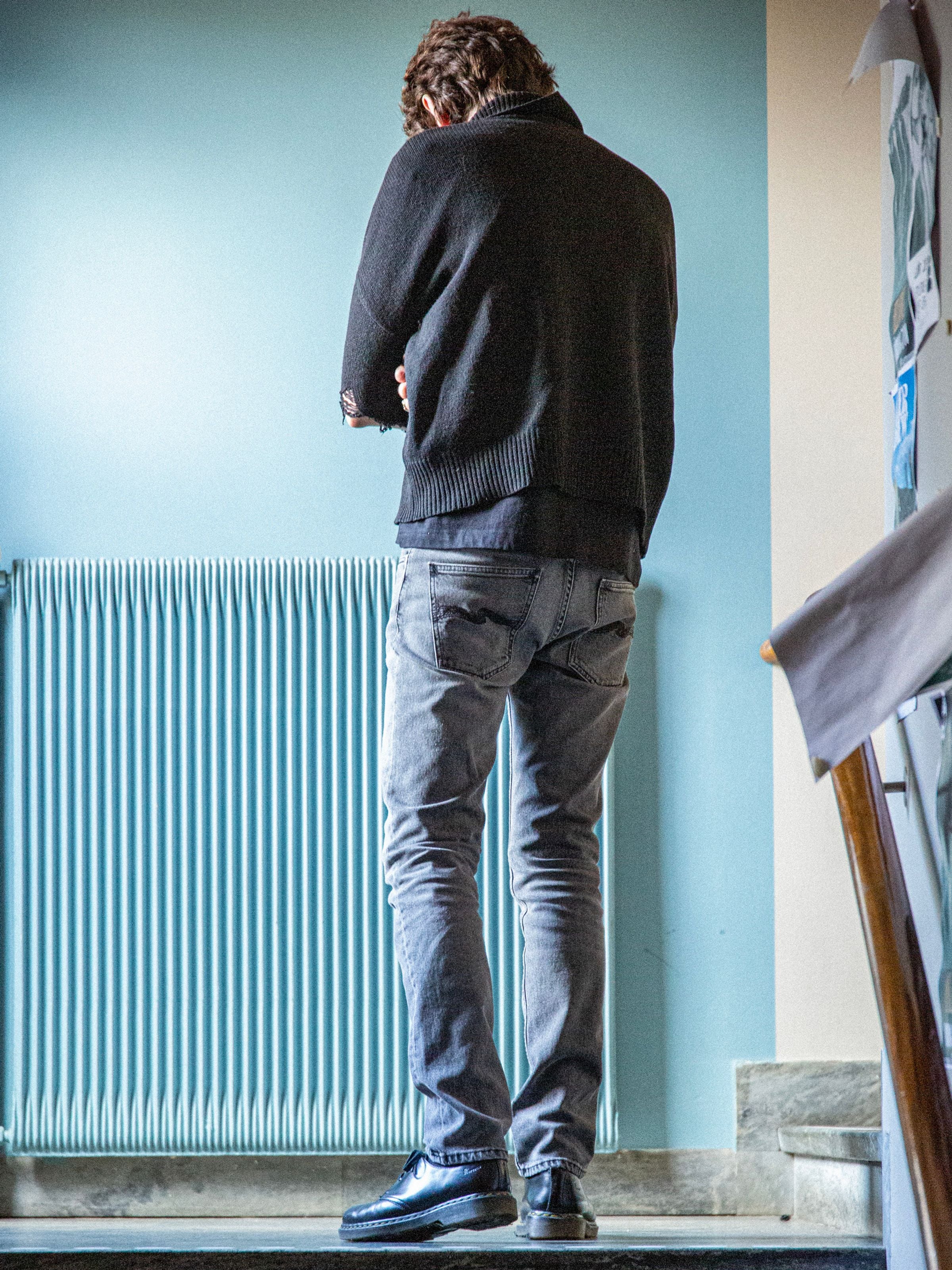Nudie Jeans Grim Tim Cloud Grey, men's slim fit jeans, shown from the back on a model.