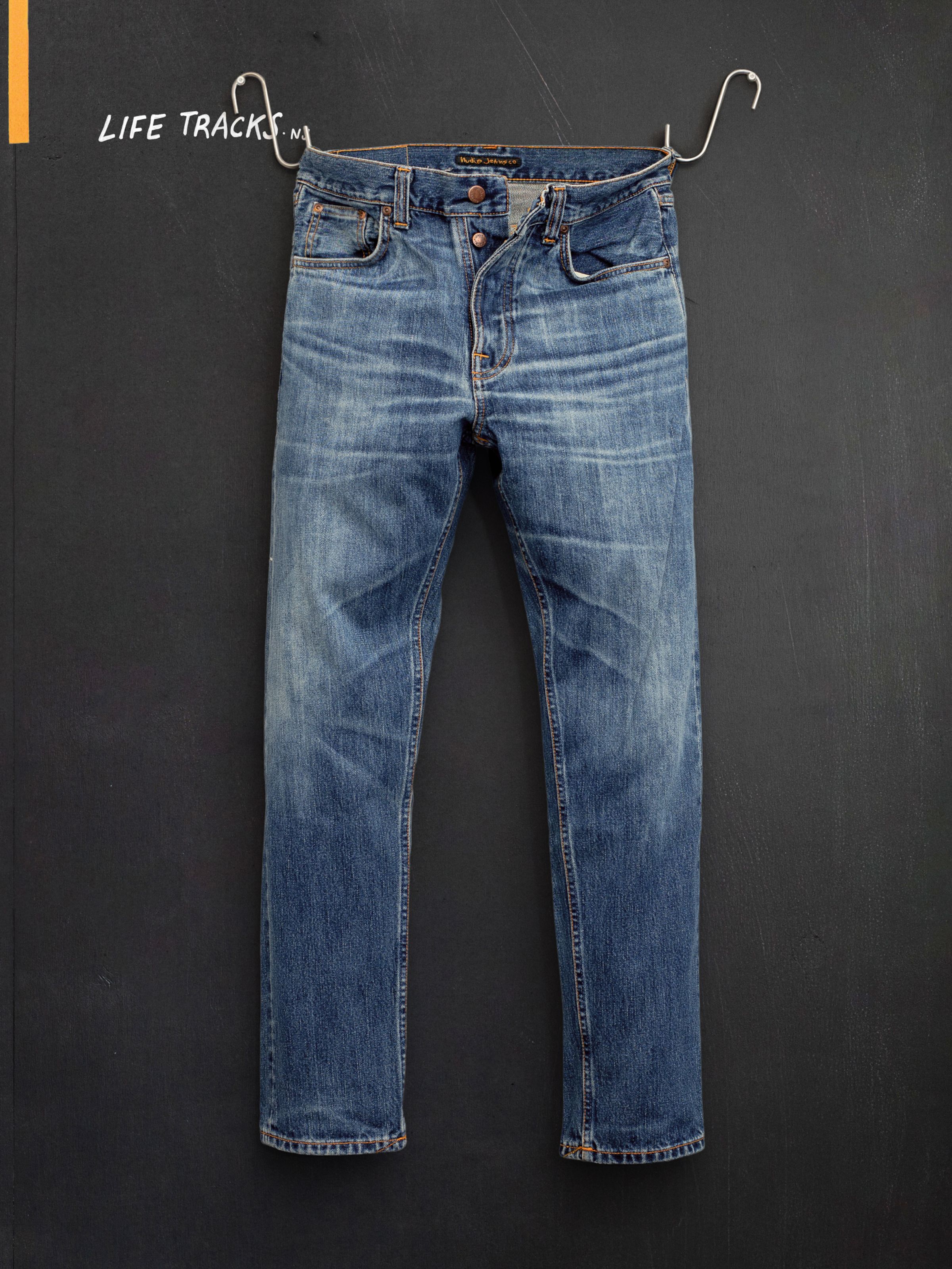 Nudie Jeans Steady Eddie II Muted Tracks, men's regular tapered jeans, flat shot showing the front.