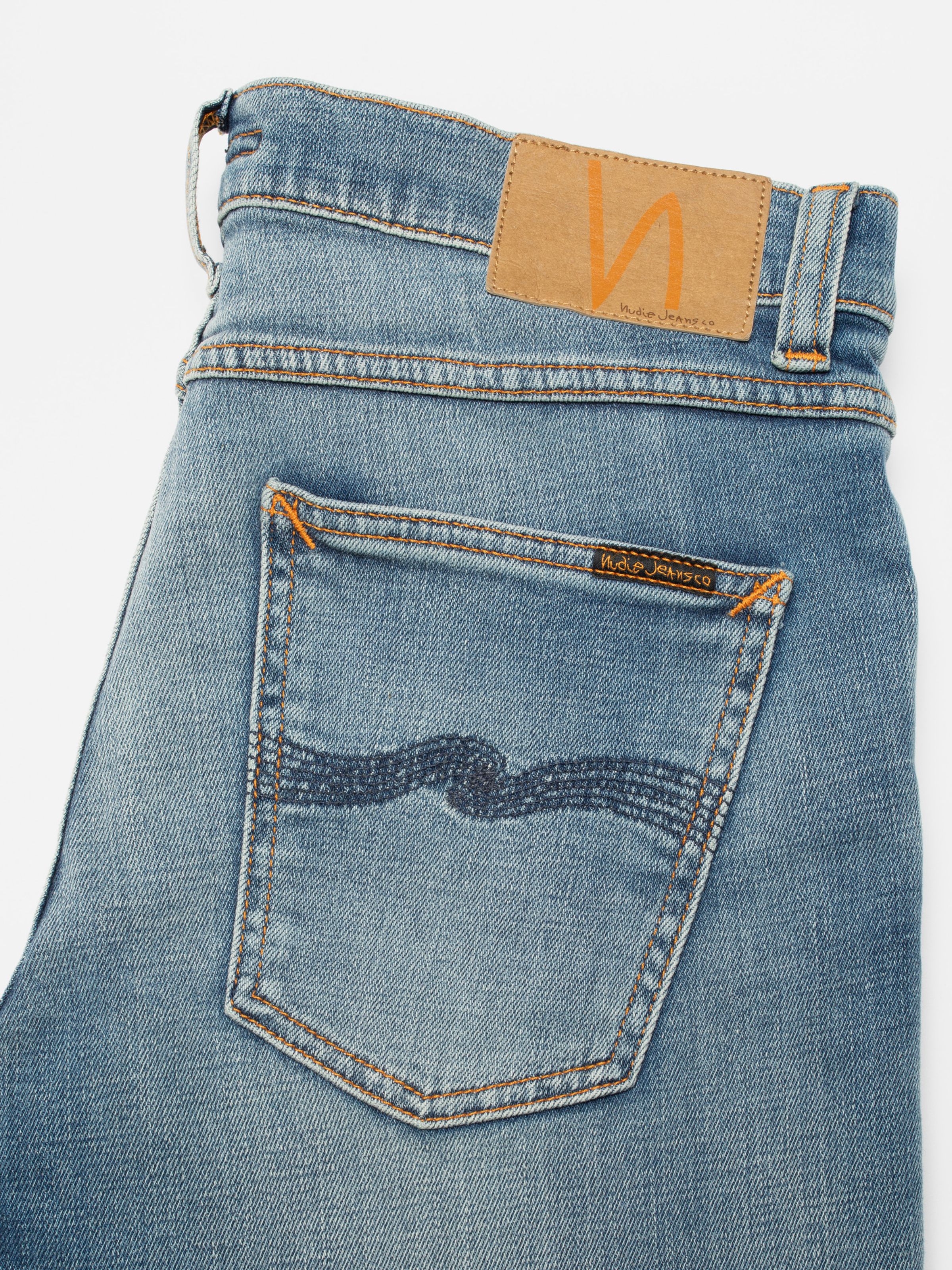 Nudie Jeans Lean Dean Blue Legend, men's slim tapered jeans, showing a close-up of the back pocket and jacron patch.