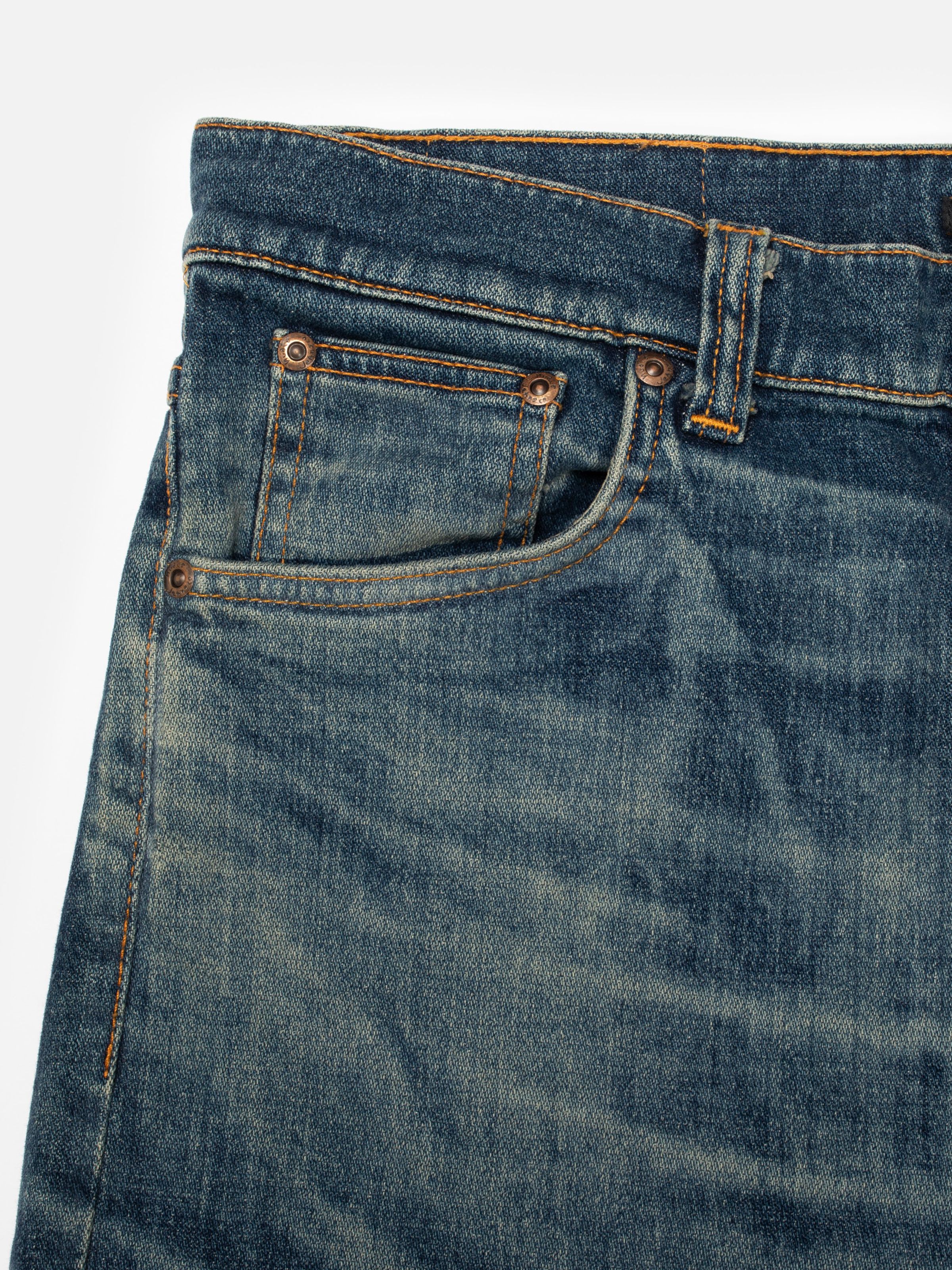 Nudie Jeans Lean Dean Salty Tracks, men's slim tapered jeans, showing a close-up of the front pocket and waistband.