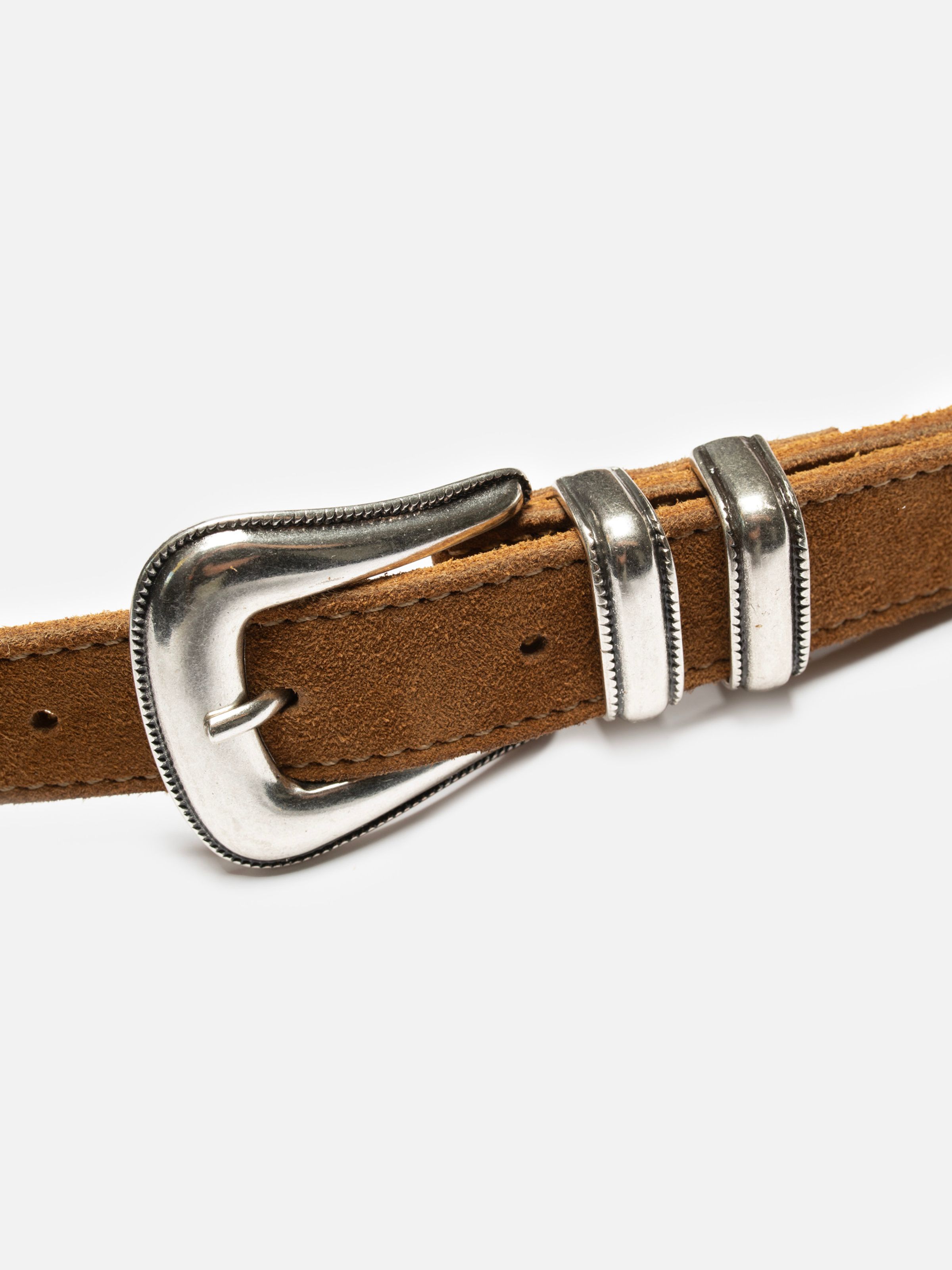 Nudie Jeans Western Suede Silver Belt in Tobacco, close-up of the antique silver buckle and decorative metal loops.