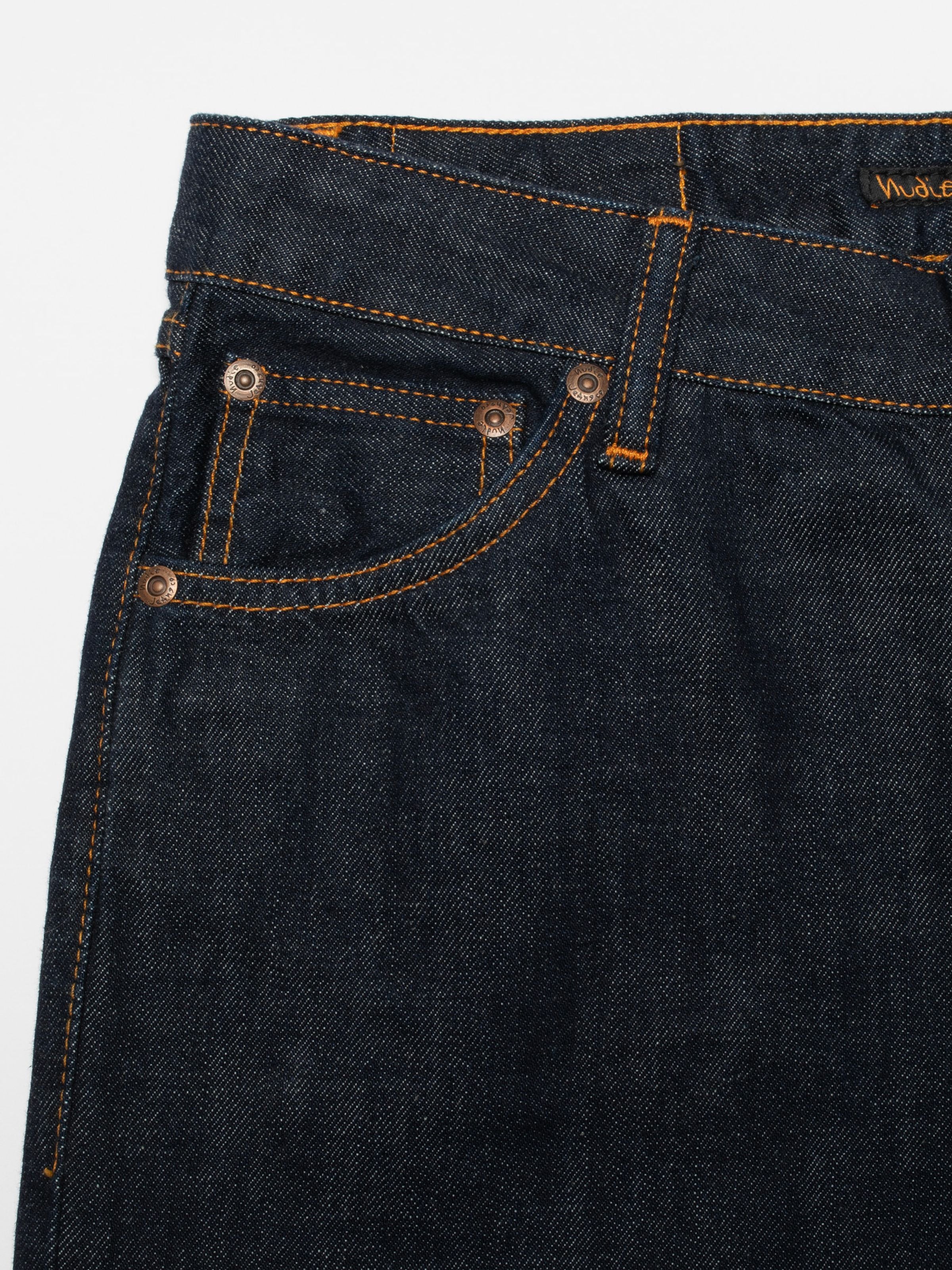 Nudie Jeans Dusty Dee One Wash, women's flared jeans, showing a close-up of the front pocket and copper rivets.