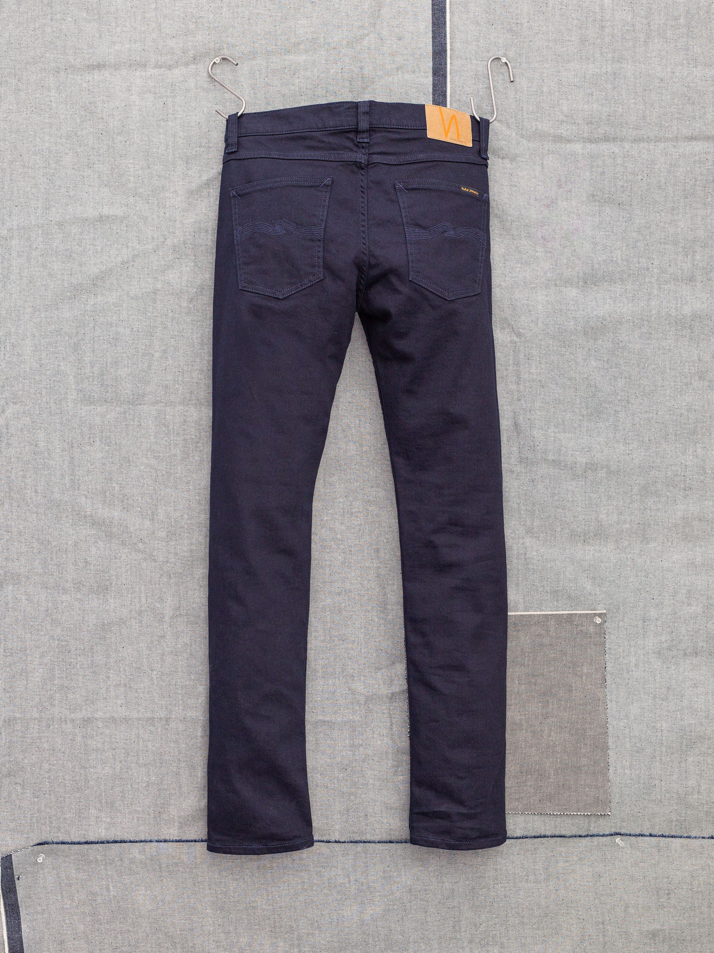 Nudie Jeans Lean Dean Everblue, men's slim tapered jeans shown from the back.