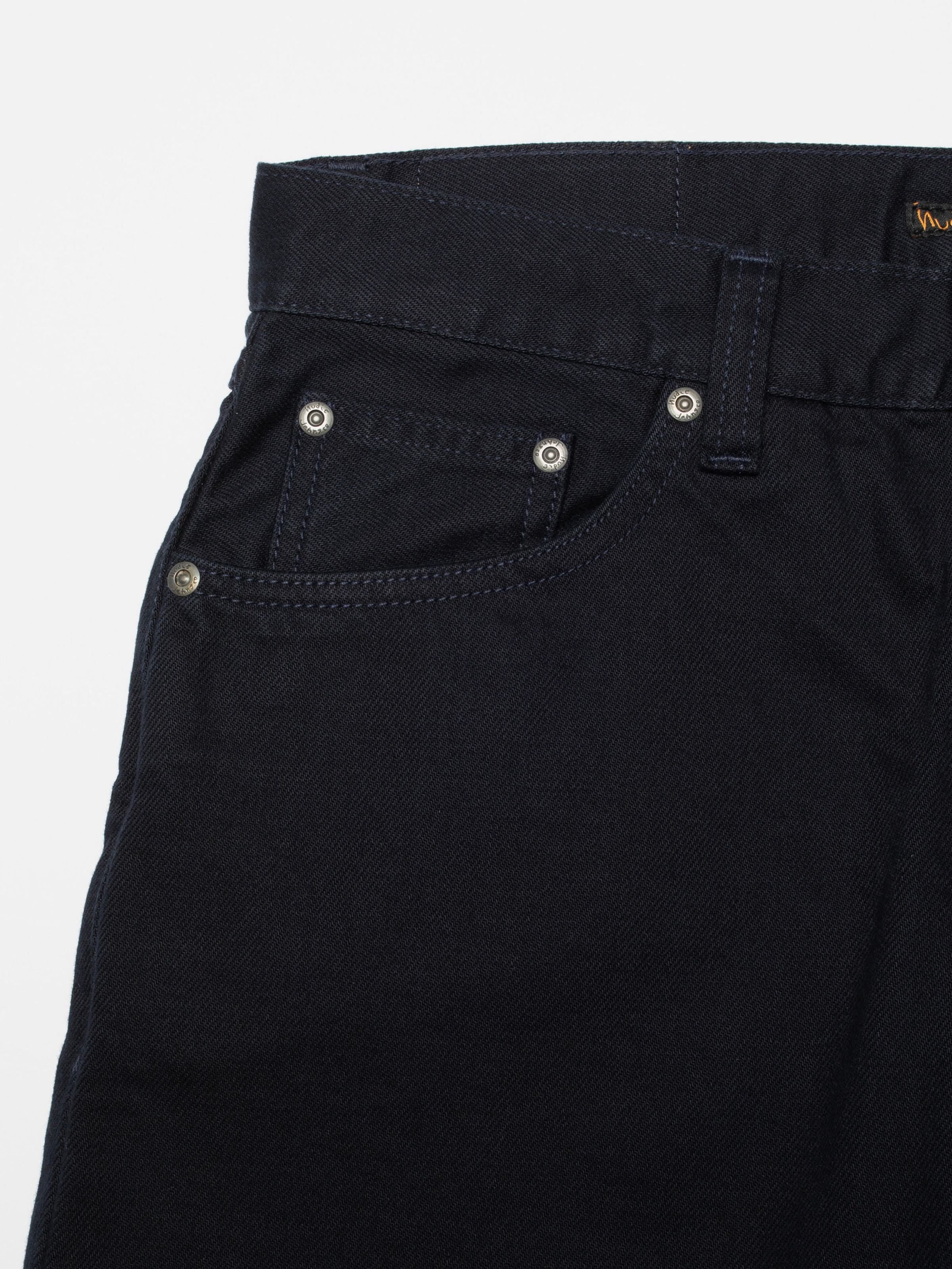 Nudie Jeans Rad Rufus Everblue, men's regular fit jeans, close-up of the front pocket, coin pocket, and rivets.