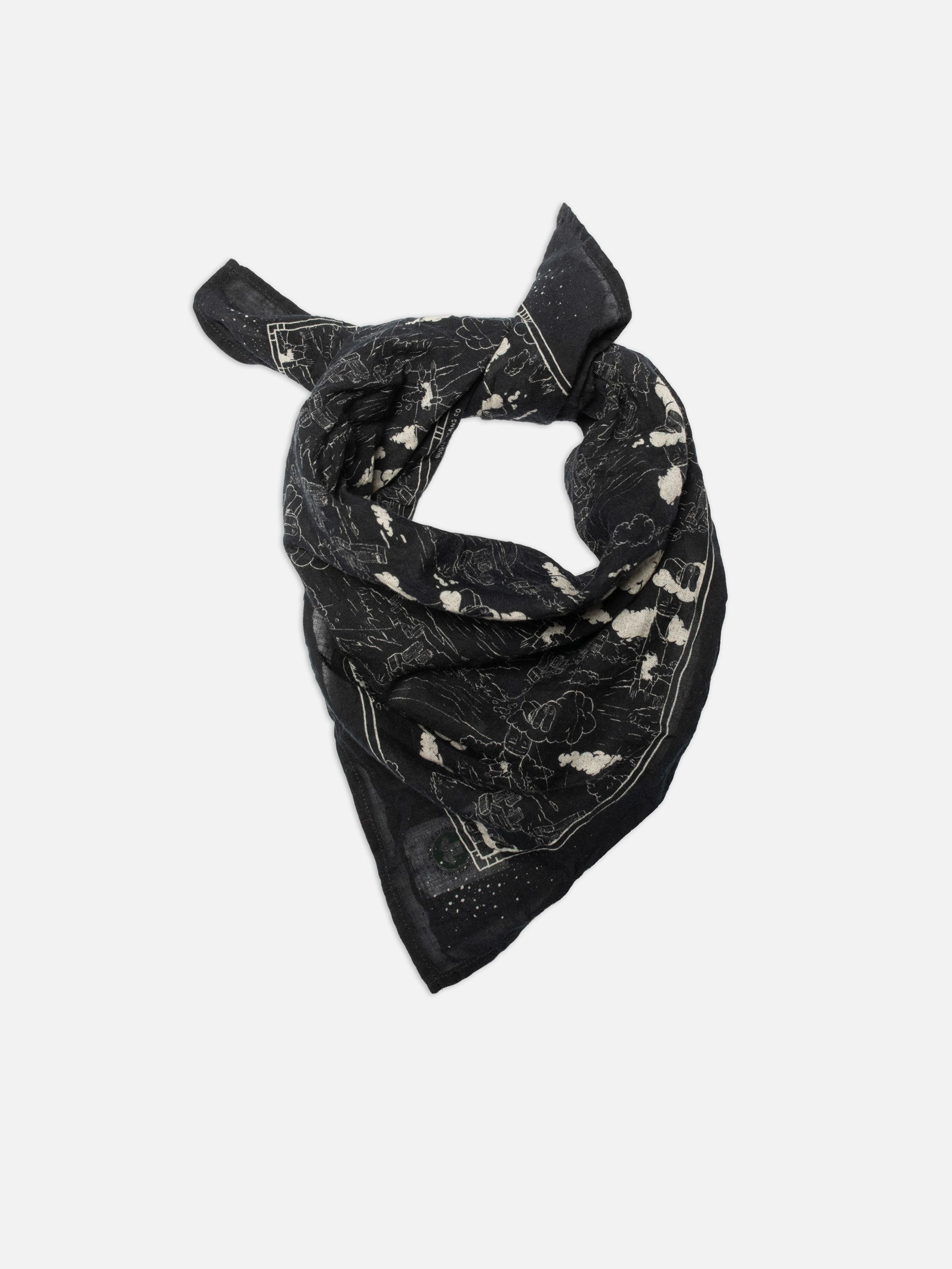 Nudie Jeans Ingrid Bandana Drift Away Black, organic cotton bandana with surrealist artwork, shown tied in a knot.