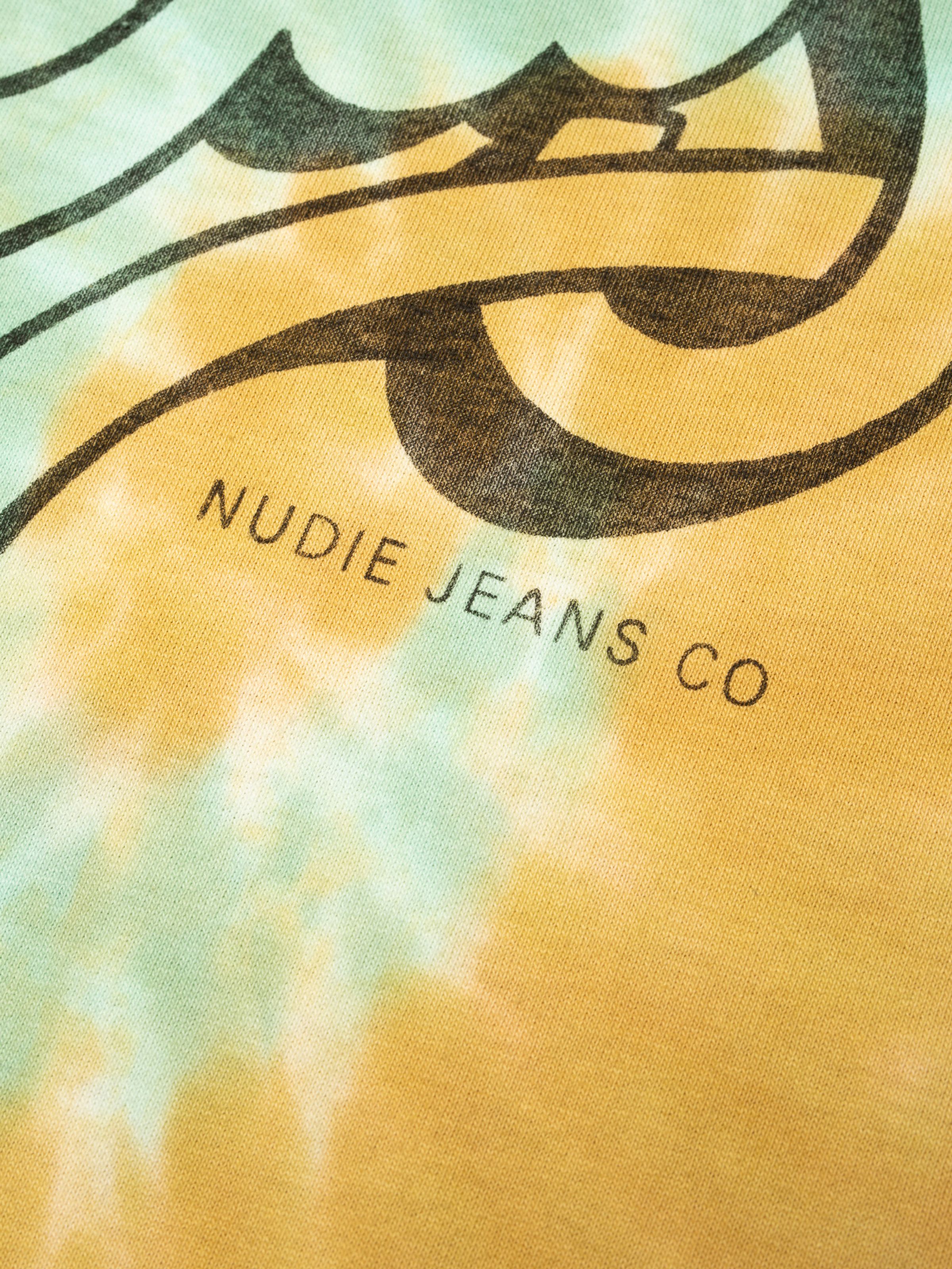Nudie Jeans Rita T-Shirt Take It Easy, close-up of the tie-dye fabric and NUDIE JEANS CO chest print.