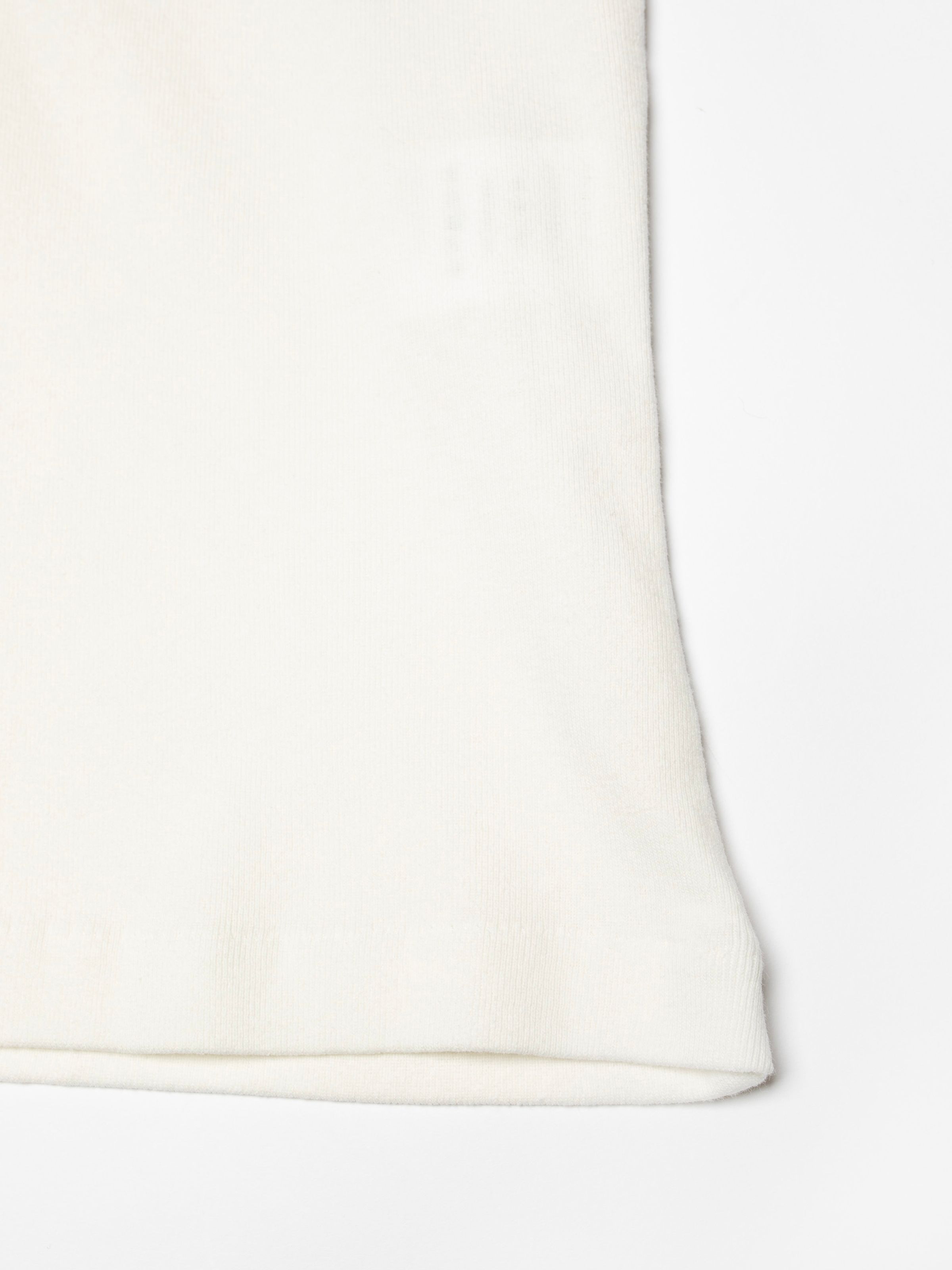 Nudie Jeans Eve T-Shirt Take It Easy Offwhite/Black, close-up of the organic cotton 1x1 rib knit fabric.