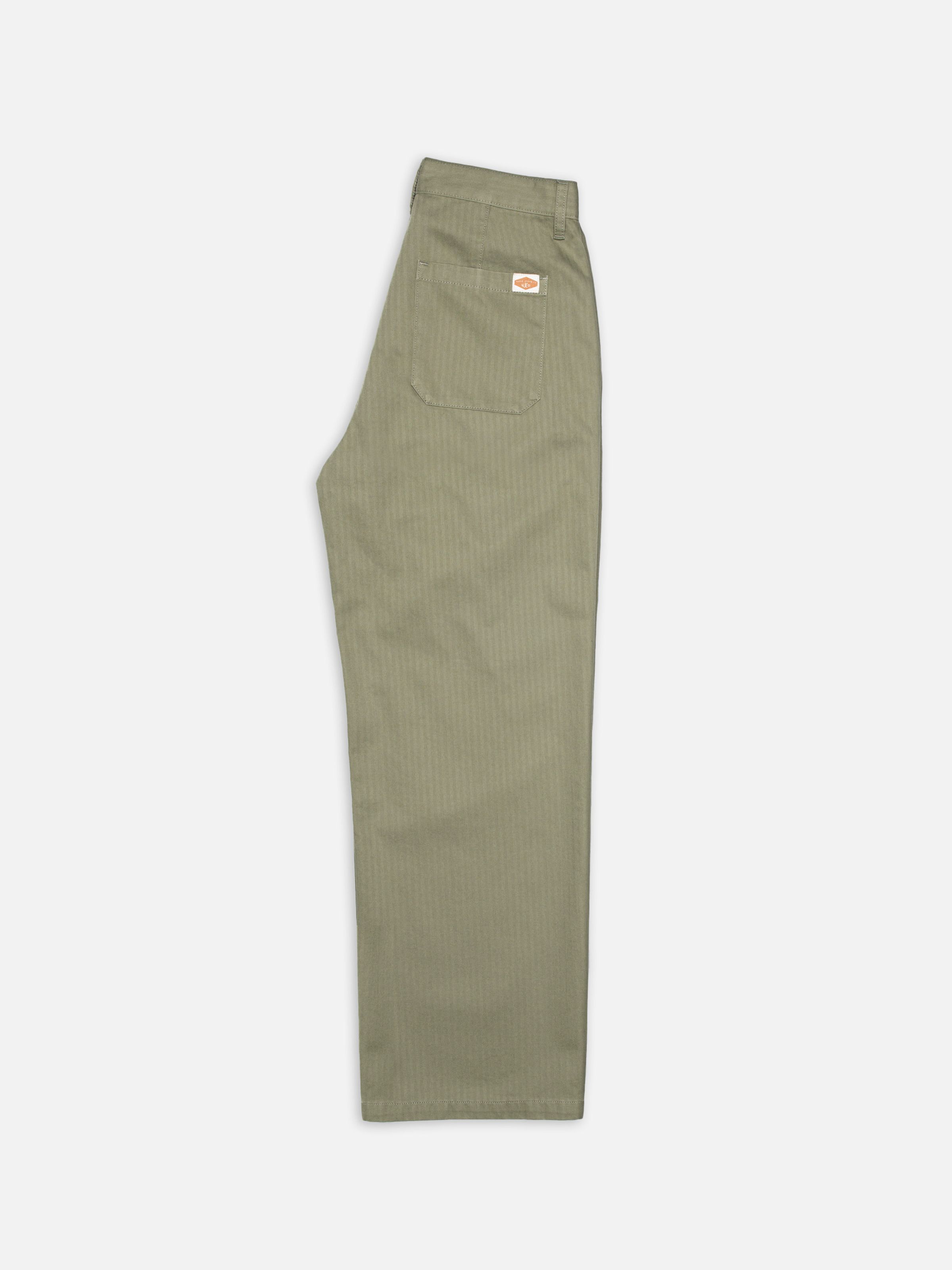 Nudie Jeans Wendy Herringbone Pale Green, women's wide-leg pants, shown folded sideways against a white background.