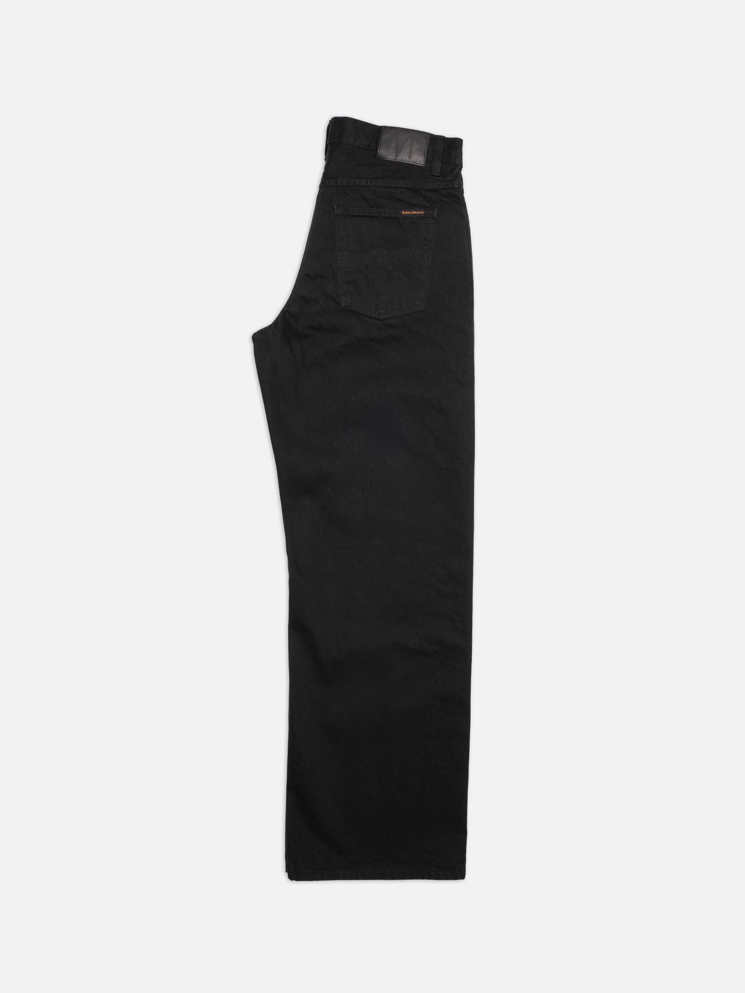 Nudie Jeans Loud Larry Black Water, a pair of men's loose fit jeans in washed black denim, shown laid flat and folded.