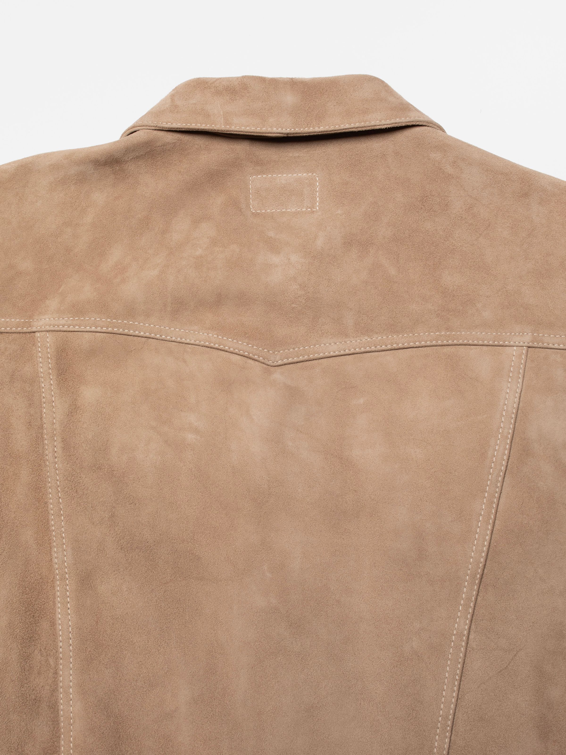 Nudie Jeans Willy Suede Jacket in Mud, close-up of the back yoke and stitching details.