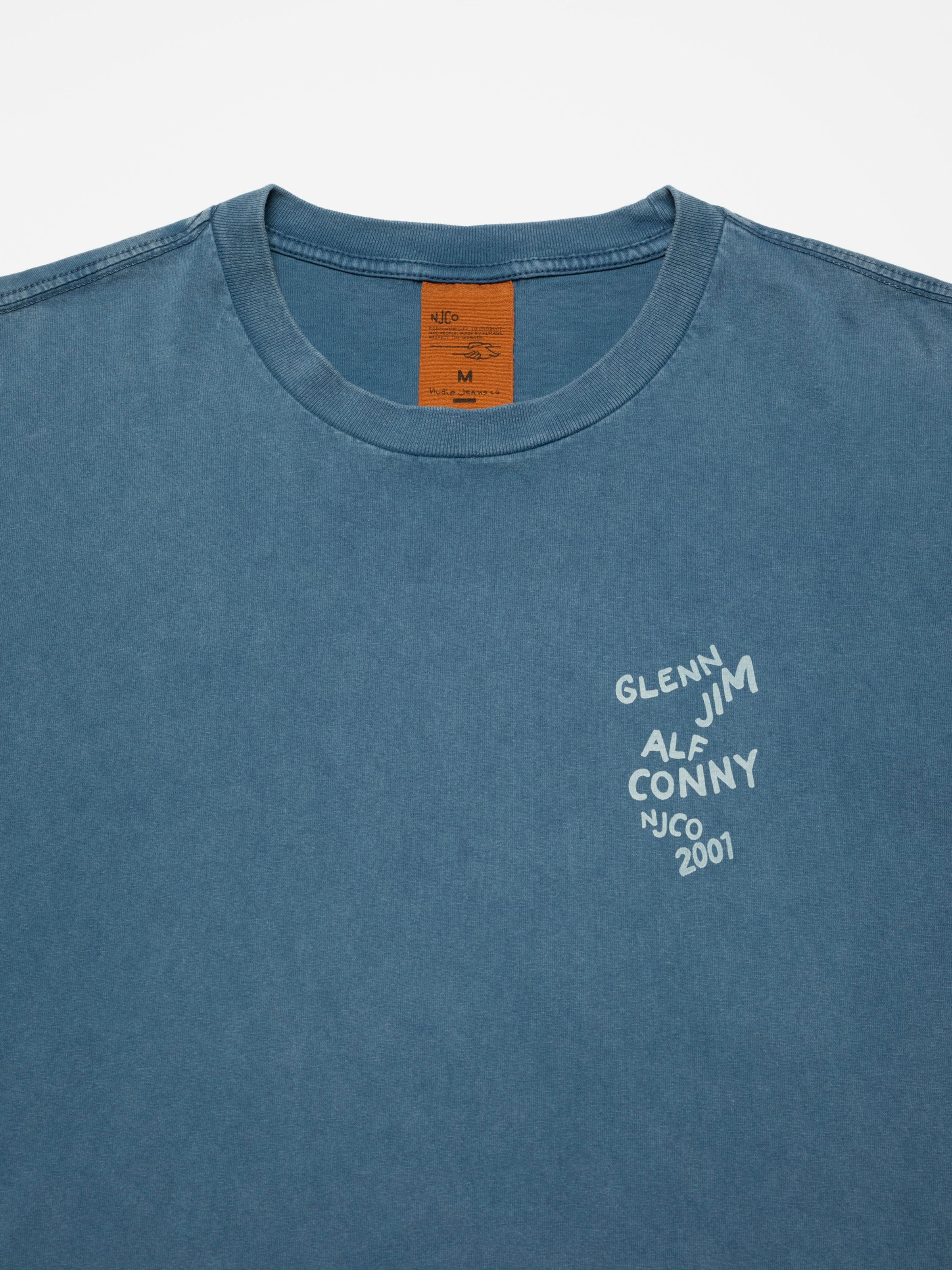 Nudie Jeans Roy T-Shirt OG Line-Up in French Blue, close-up of the chest print and neckline.