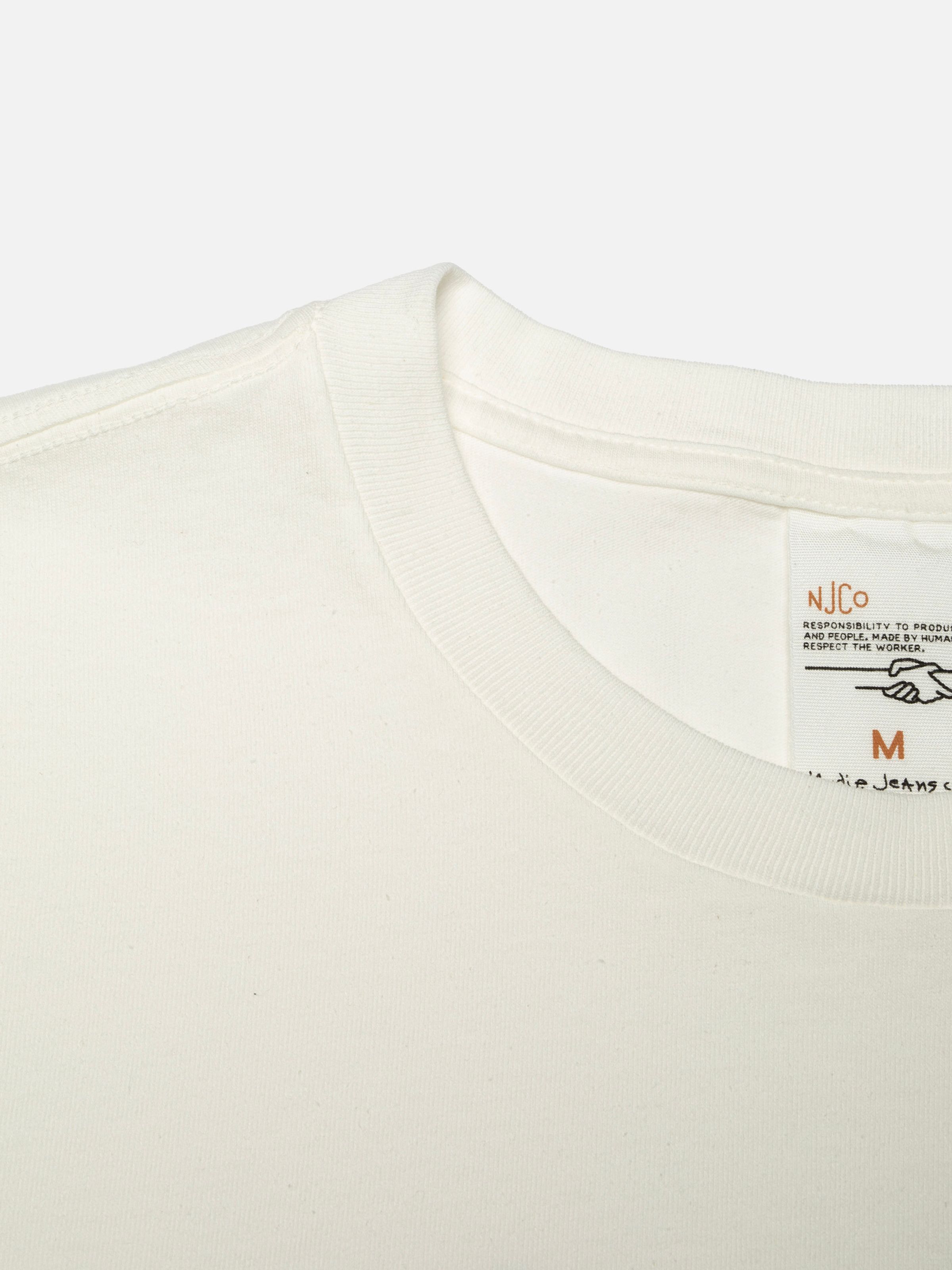 Nudie Jeans Roy T-Shirt Fab Four in Chalk White, close-up of the ribbed crew neck and interior label.