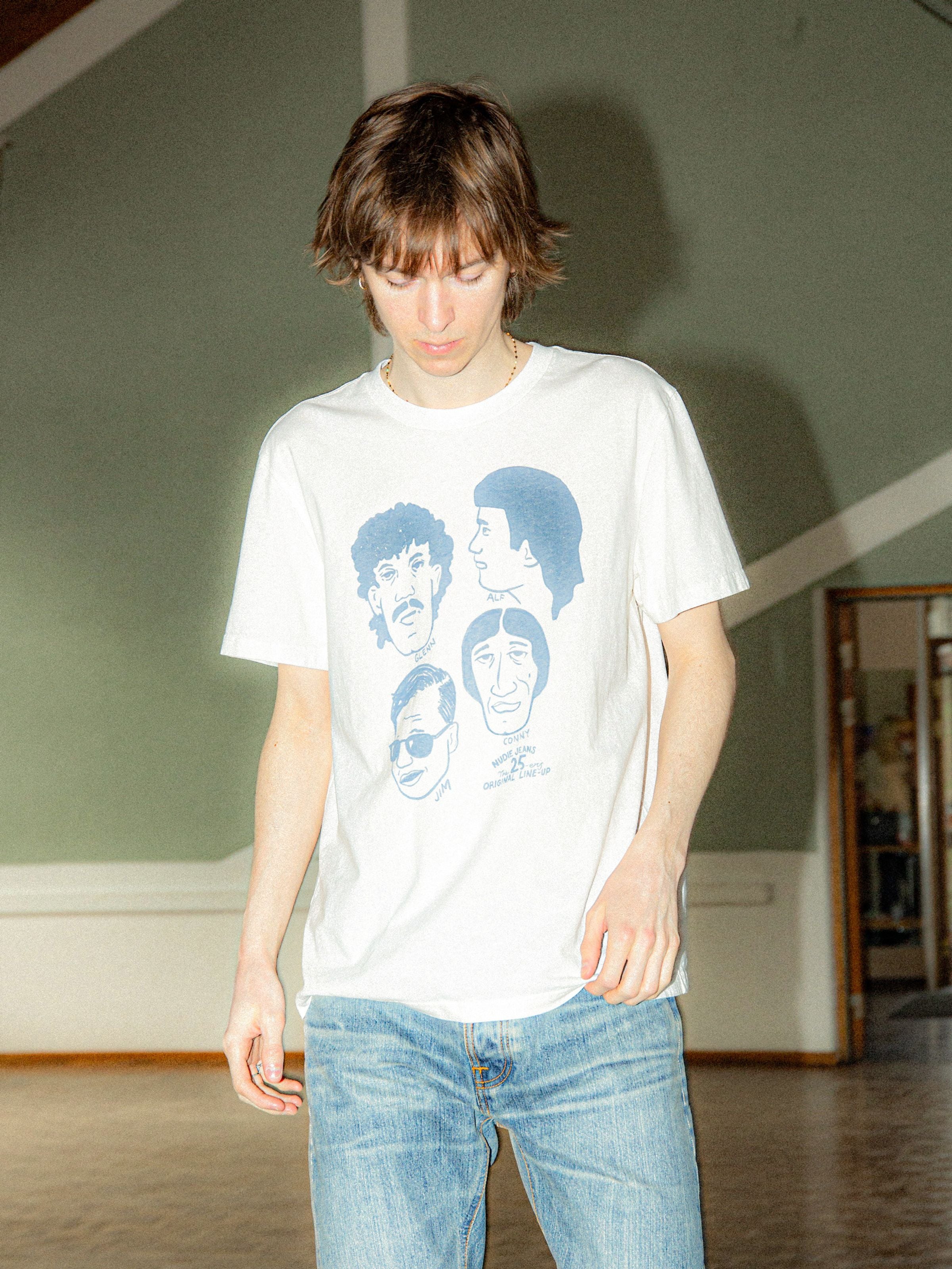 Nudie Jeans Roy T-Shirt Fab Four in Chalk White, men's relaxed-fit organic cotton t-shirt with a graphic print on a model.