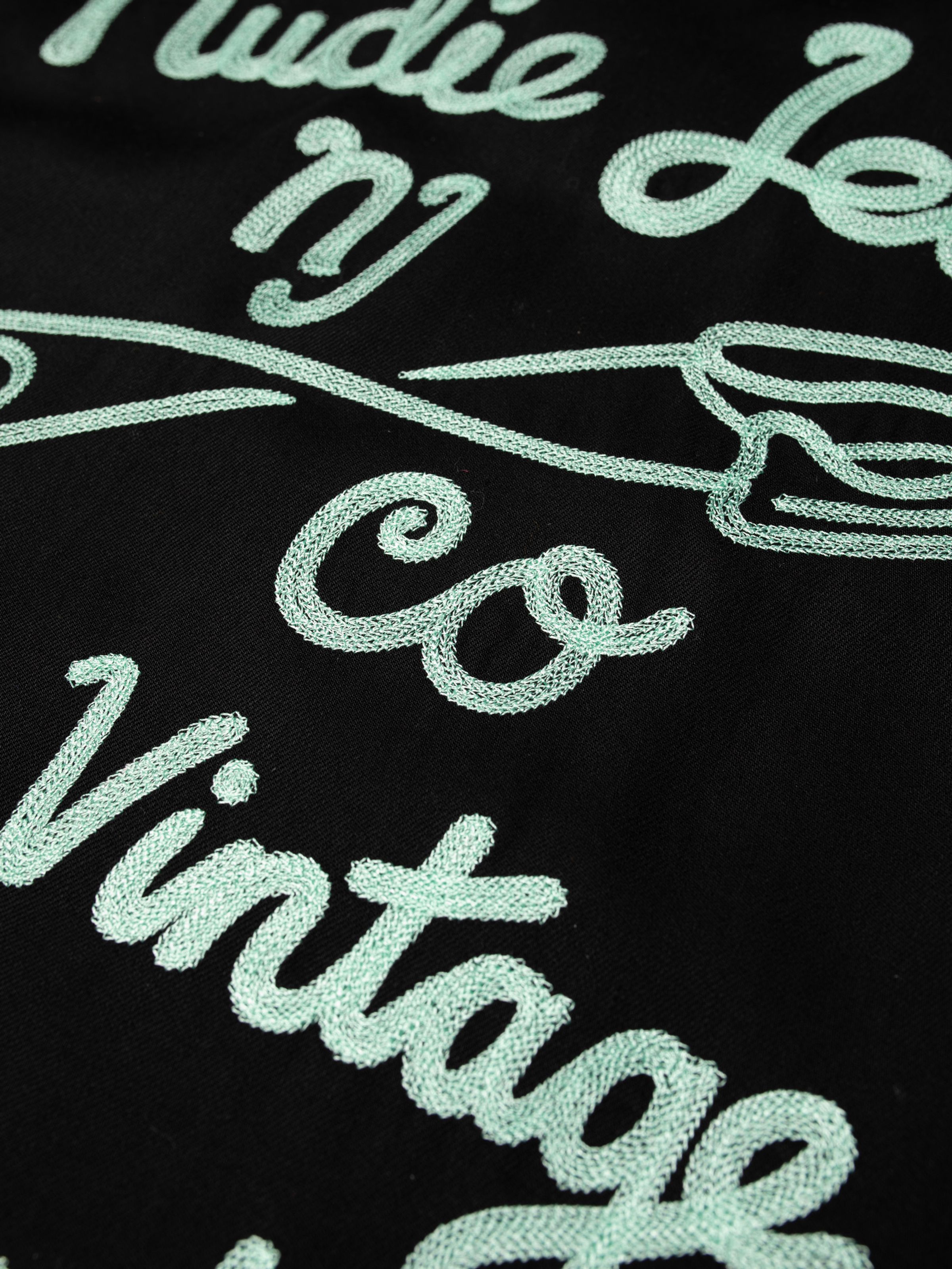 Nudie Jeans Arthur Bowling Shirt Saftey Pin, close-up of the mint green chain stitch embroidery on the back.
