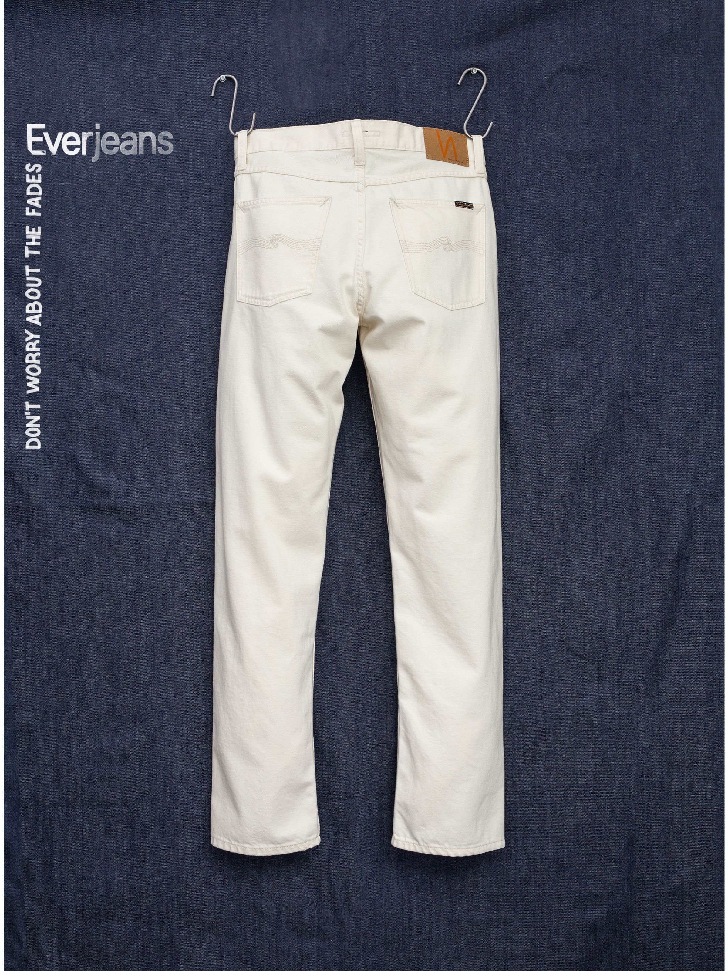 Nudie Jeans Rad Rufus Everivory, men's regular-fit straight-leg jeans in ivory rigid denim, shown from the back.