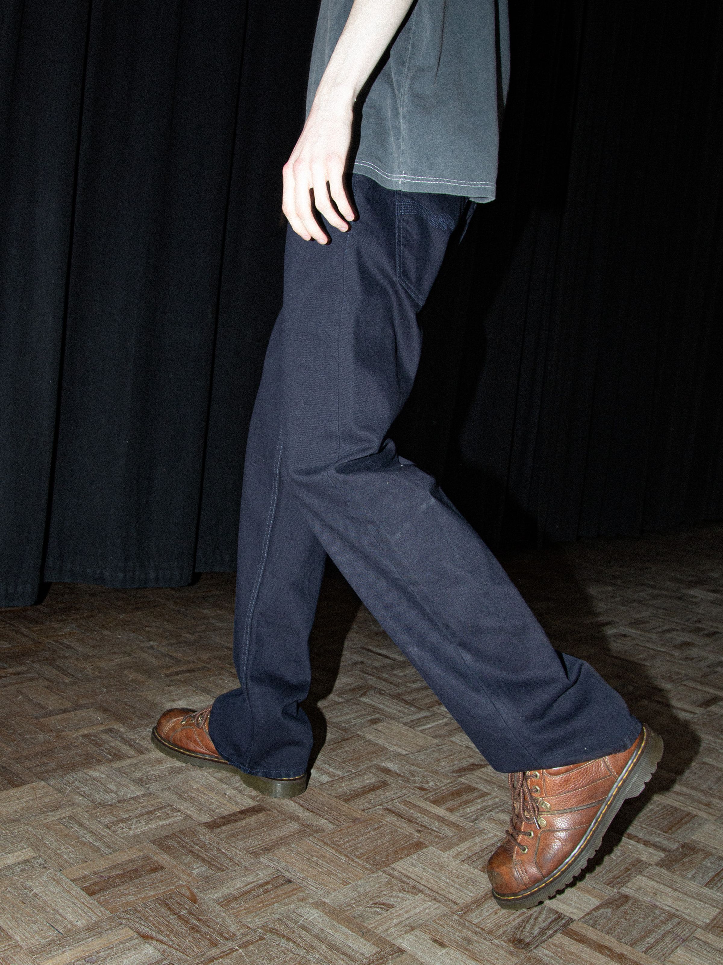 Nudie Jeans Tuff Tony Everblue, men's loose-fit jeans shown from the waist down on a model walking.