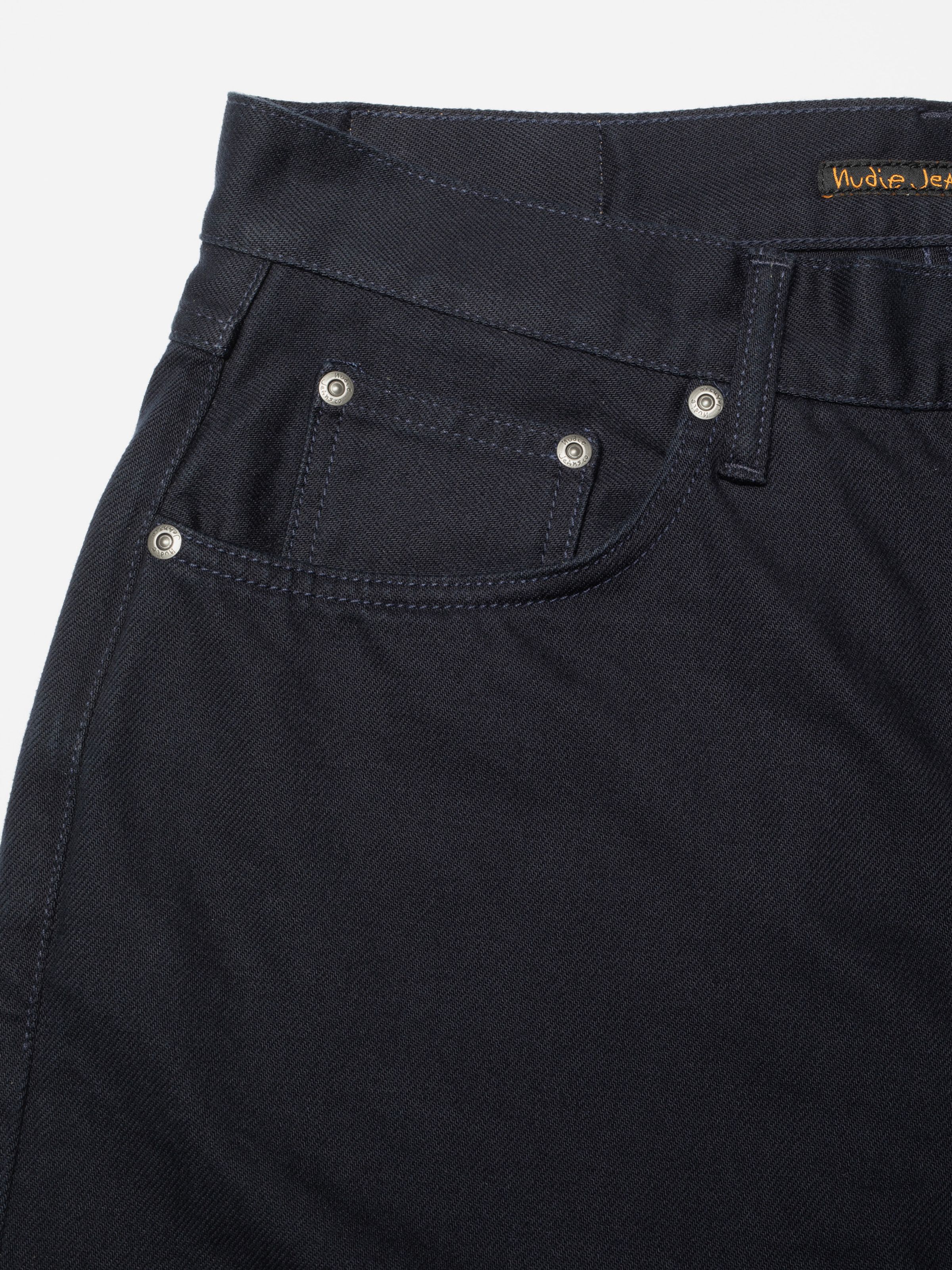 Nudie Jeans Tuff Tony Everblue, close-up of the front pocket and antique silver rivets.
