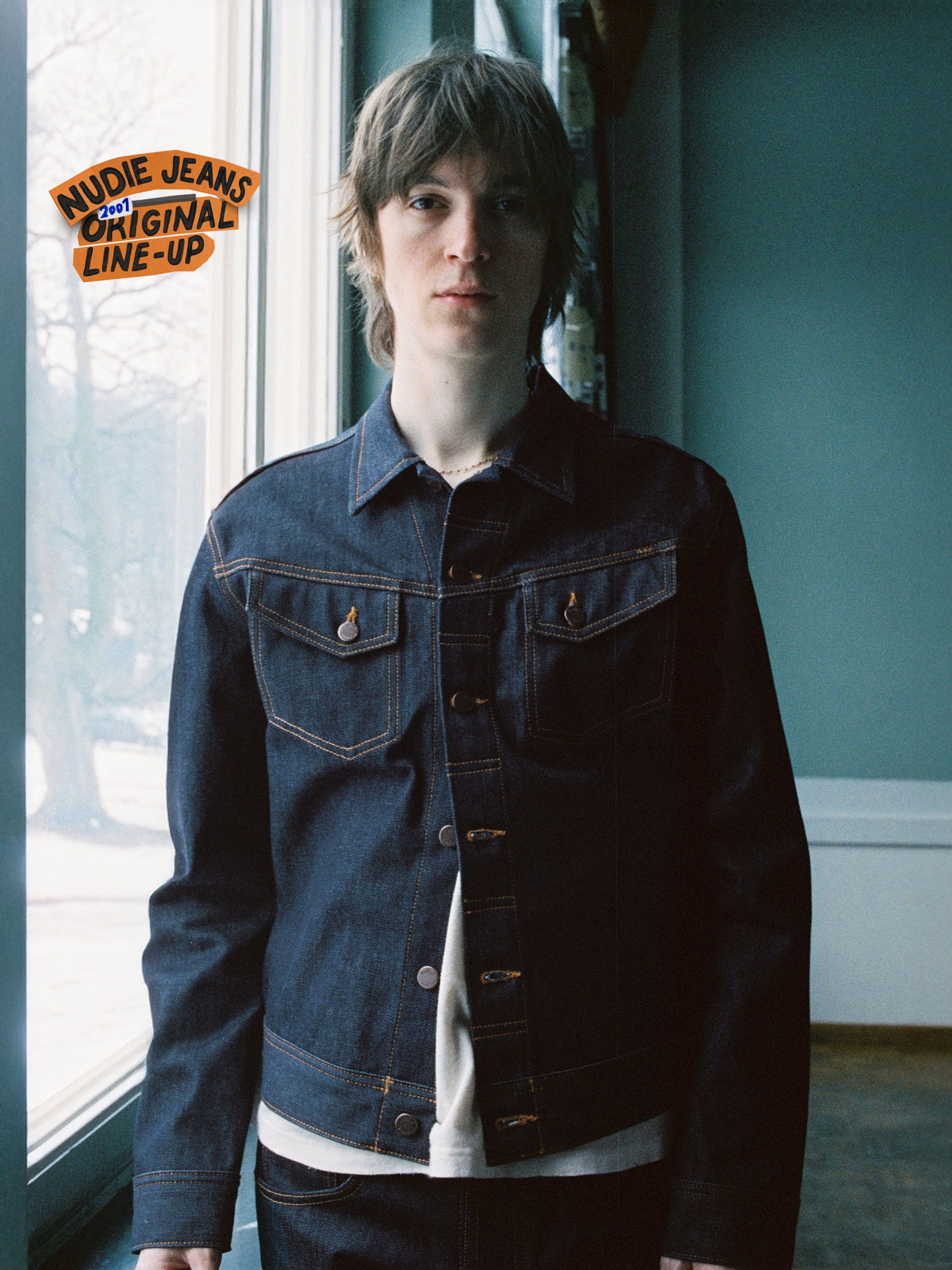 Nudie Jeans Conny Denim Jacket Dry One, a slim-fit dark blue rigid denim jacket with orange stitching and copper buttons.