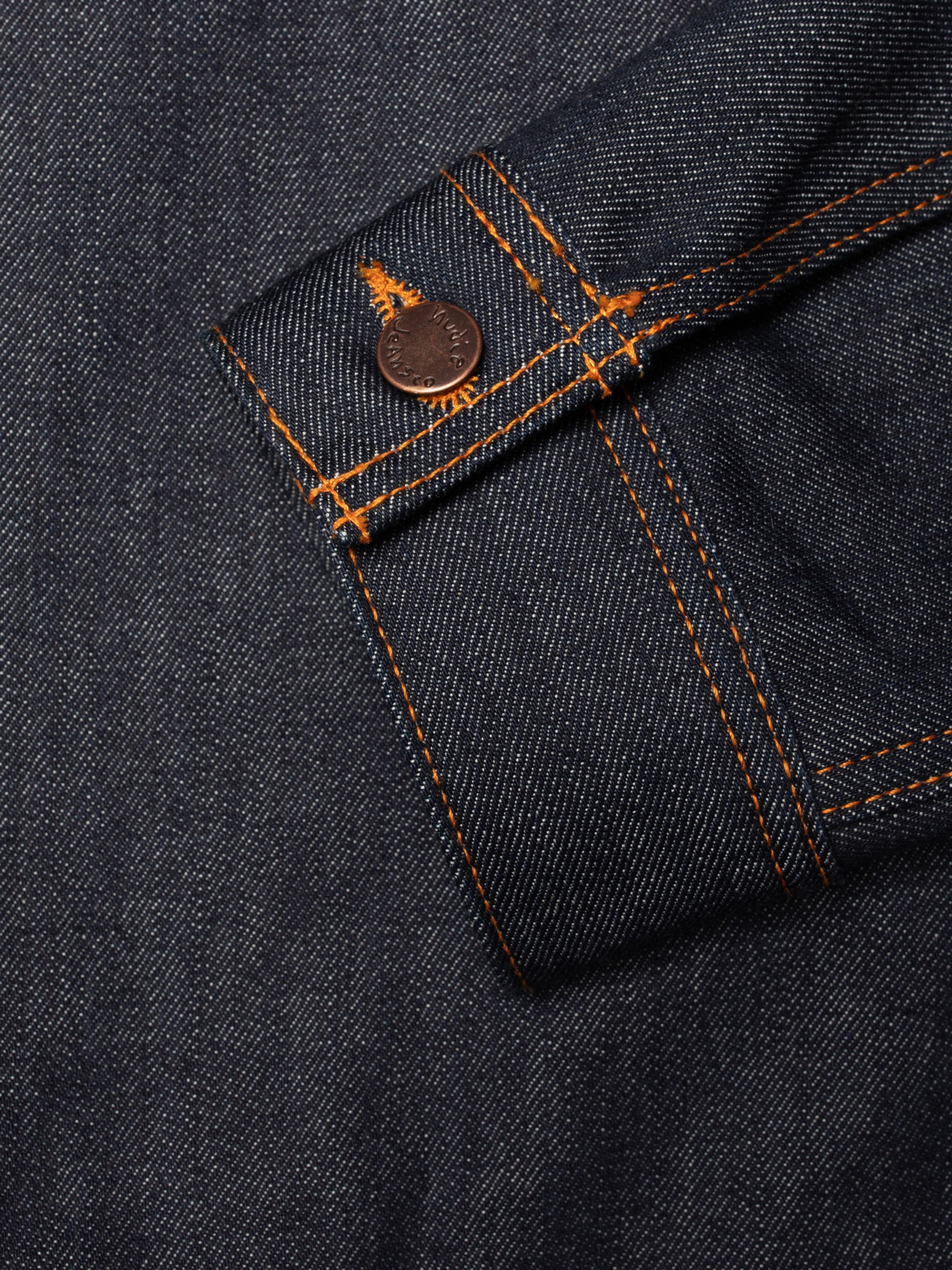 Conny Denim Jacket Dry One cuff detail with contrast orange stitching and a branded copper button on dry indigo denim.