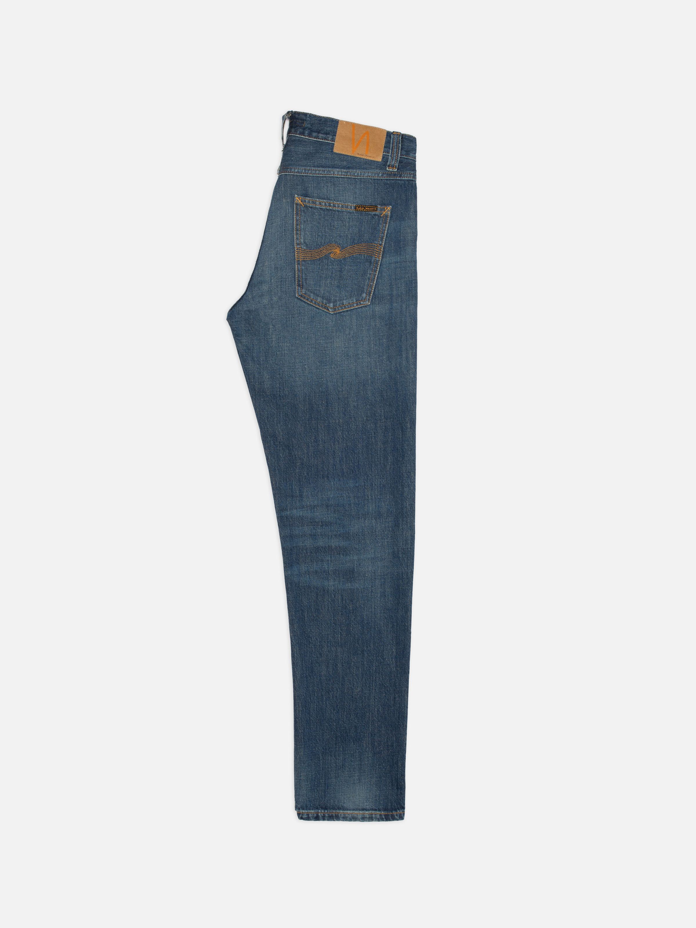 Nudie Jeans Steady Eddie II Indigo Dew, men's regular fit tapered jeans shown from the side against a white background.