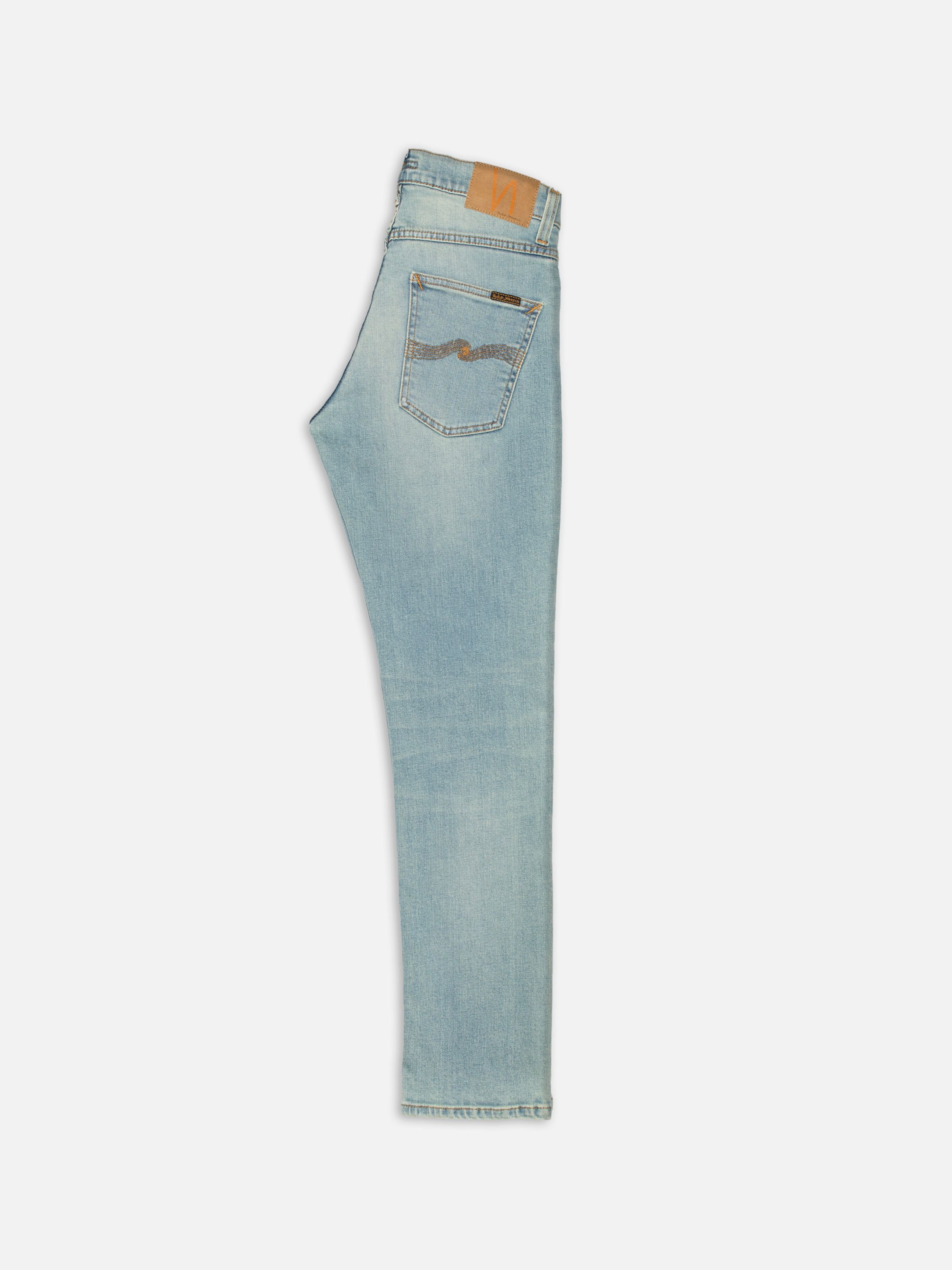 Nudie Jeans Grim Tim Shallow Waters, men's slim-fit jeans in a light blue wash, shown from the side on a white background.
