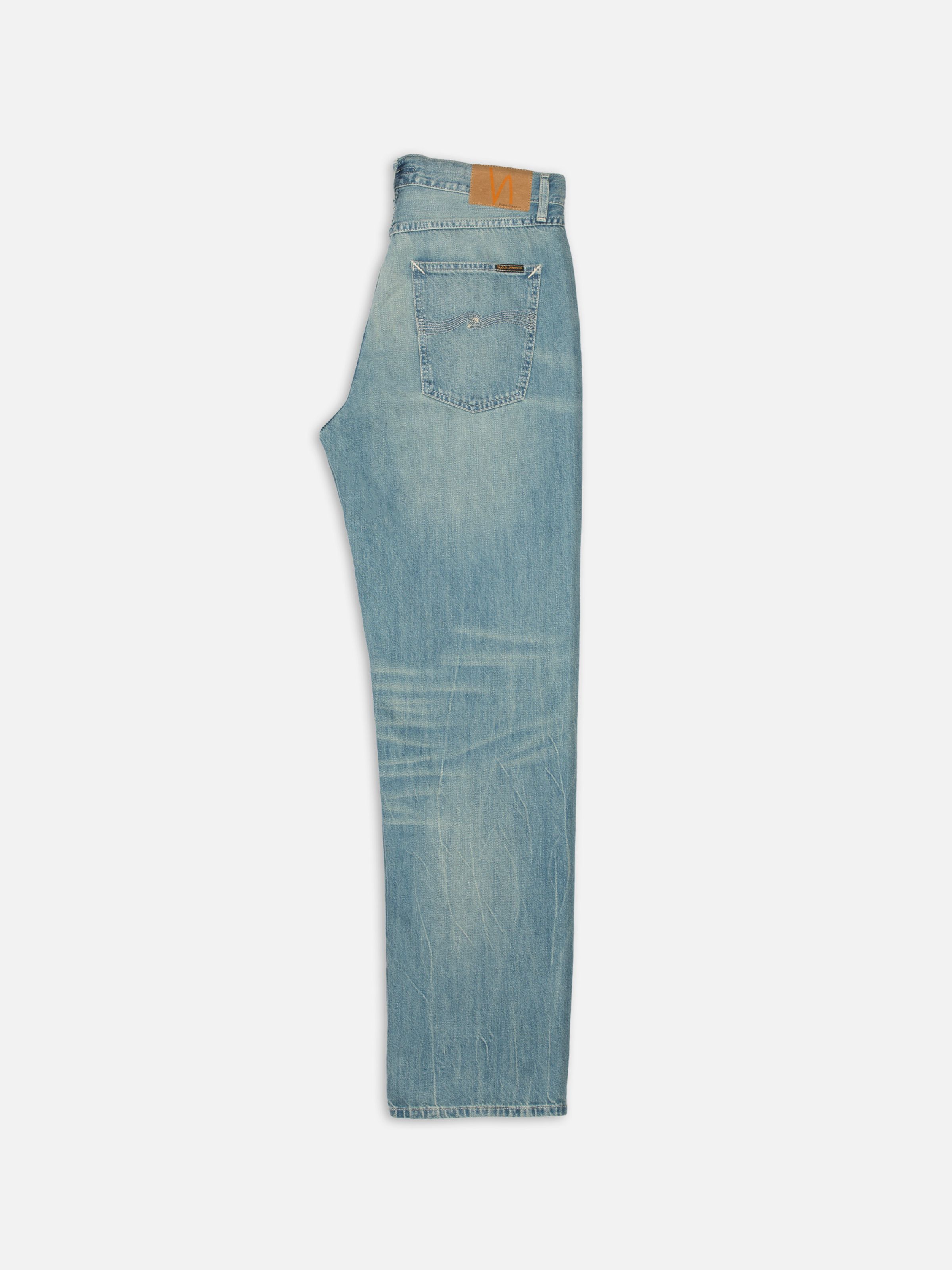 Nudie Jeans Tuff Tony Drift Wood, loose-fit wide-leg jeans in a light blue wash, shown from the side.