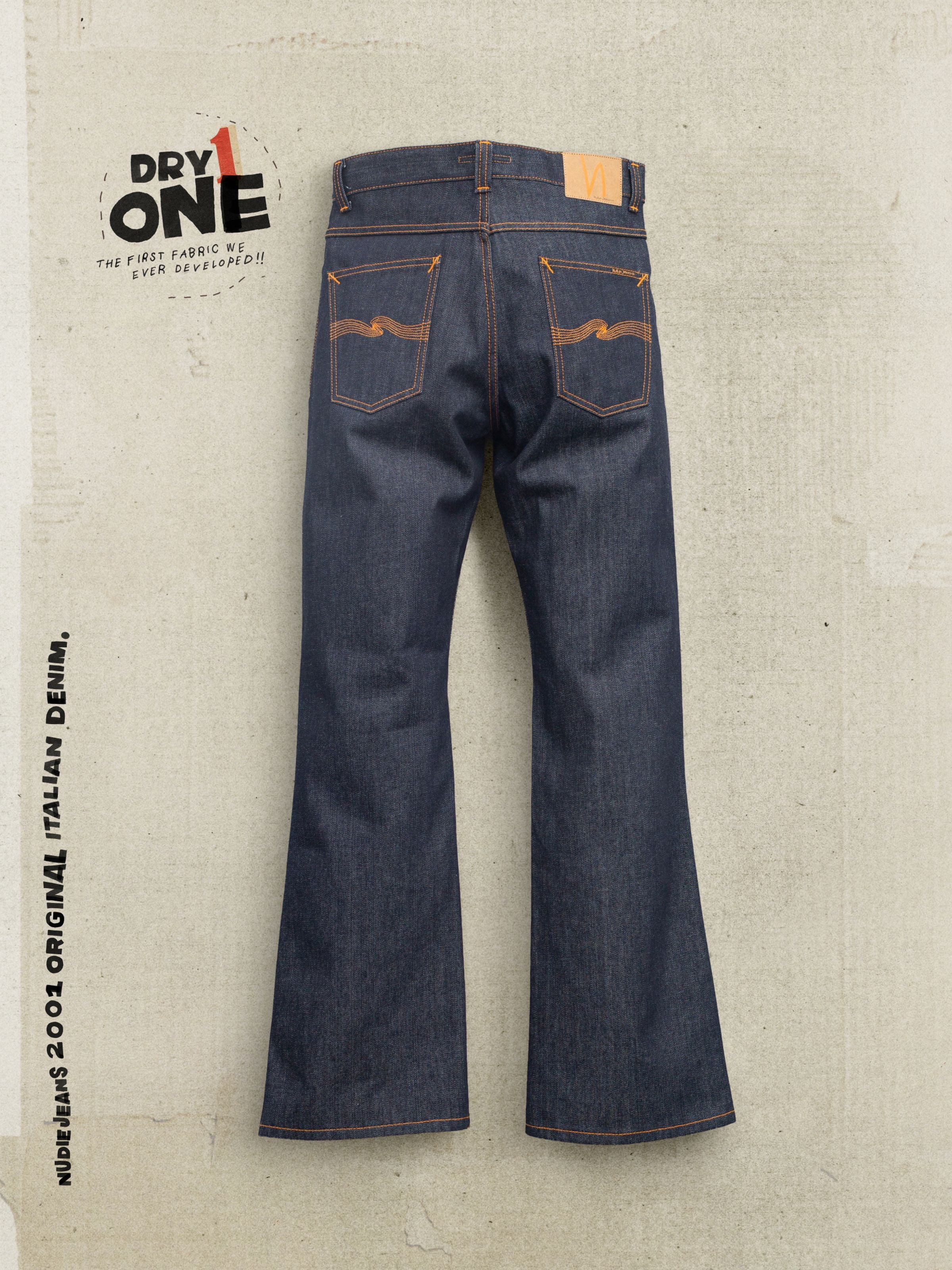 Nudie Jeans Flare Glenn Dry One, men's regular fit flared jeans in blue rigid organic cotton denim, shown from the back.