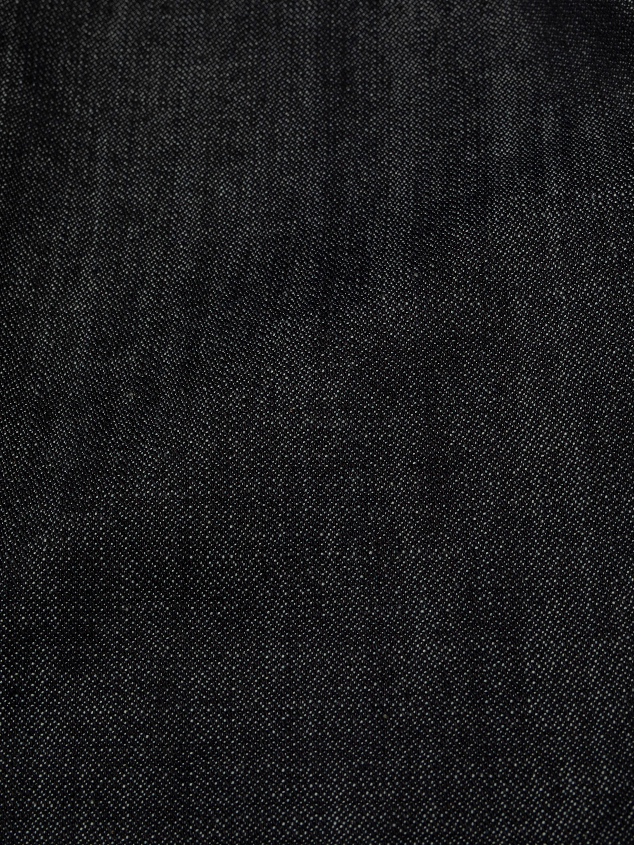 Nudie Jeans Slim Jim Dry Two, close-up of the 11.5 oz rigid denim fabric showing the broken twill texture.