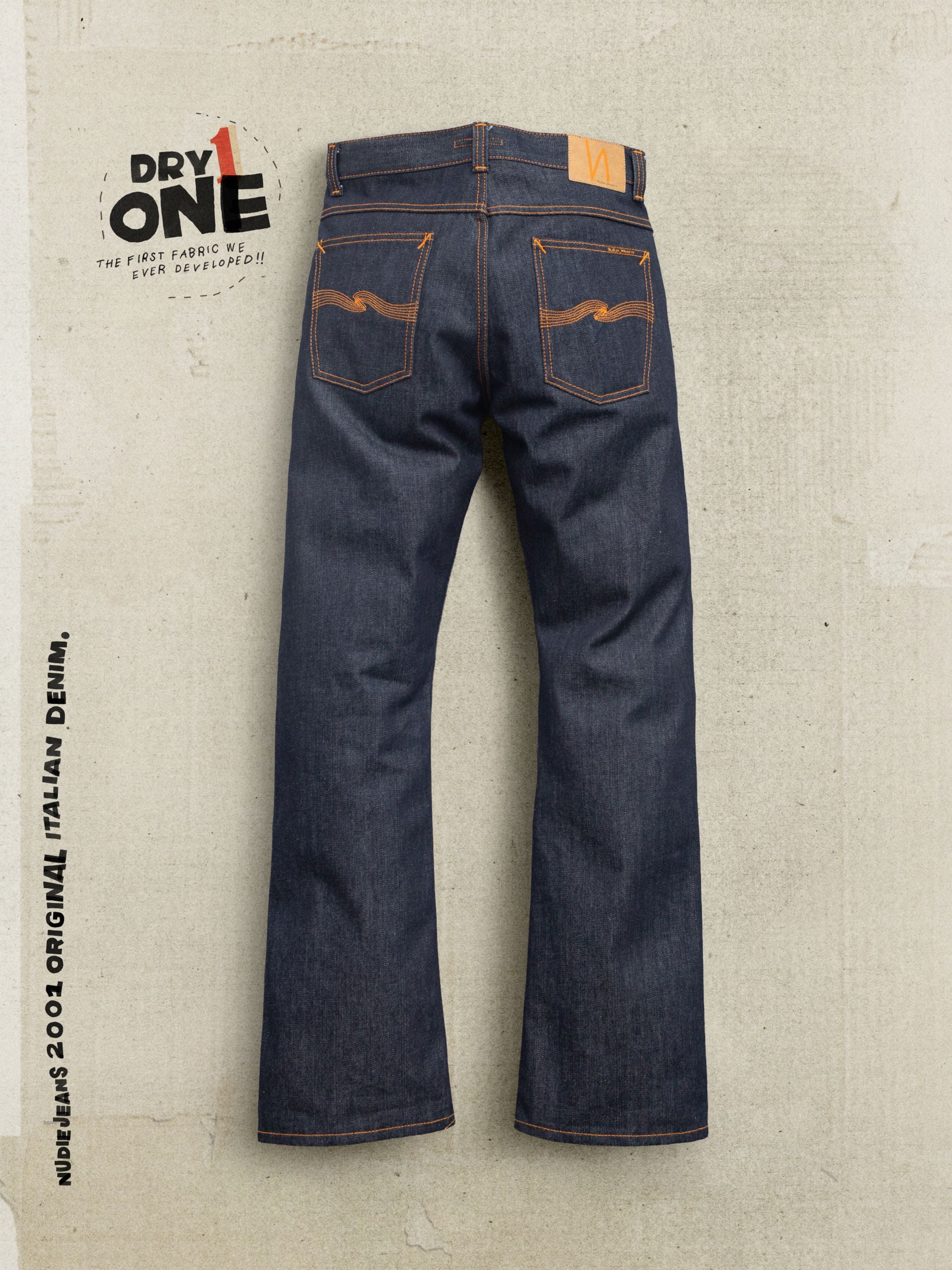 Nudie Jeans Regular Alf Dry One, back view of bootcut jeans in rigid indigo organic cotton with orange pocket embroidery.