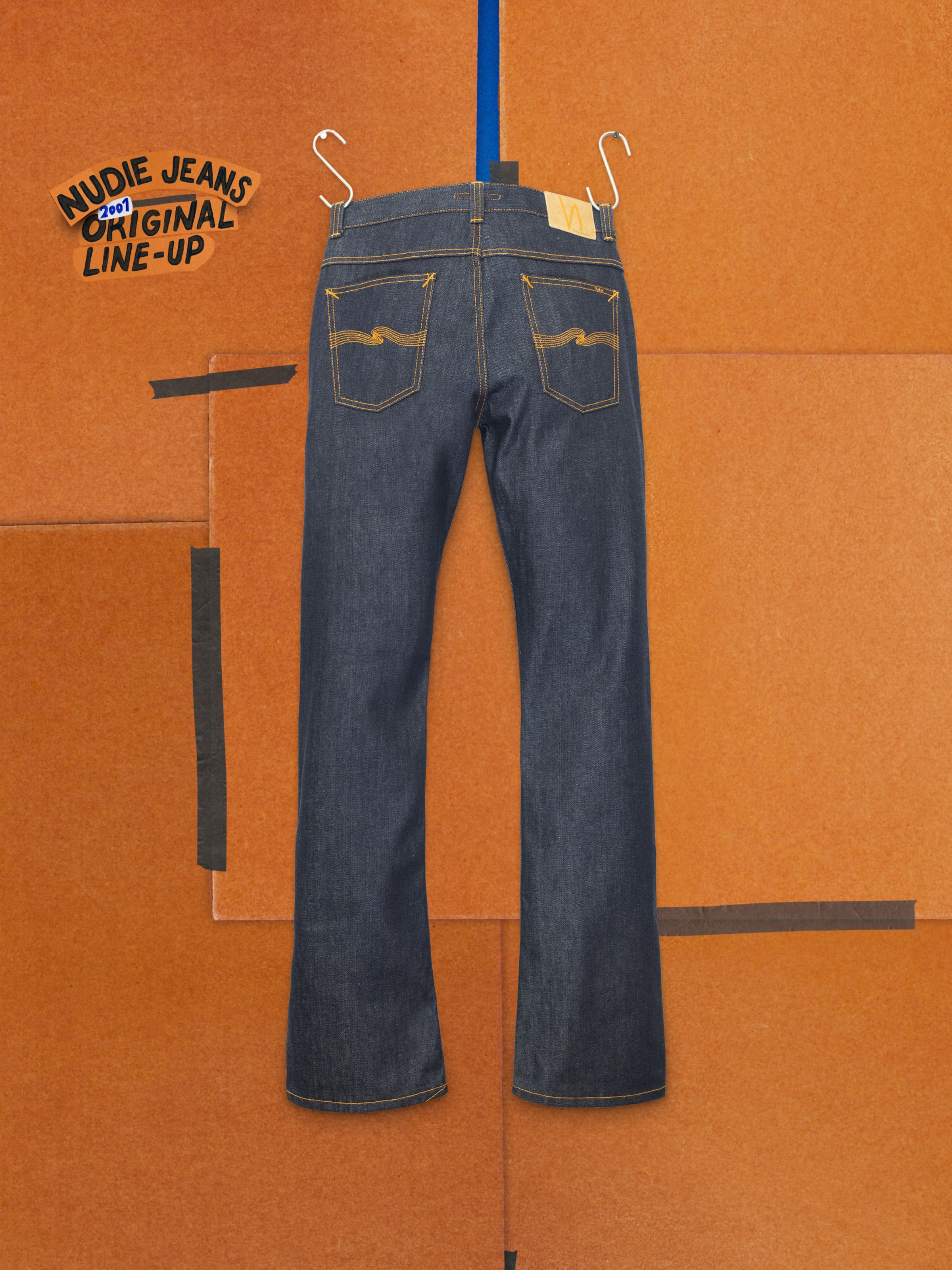 Nudie Jeans Regular Alf Dry One, regular-fit bootcut jeans in dry indigo denim with orange stitching, full back view.