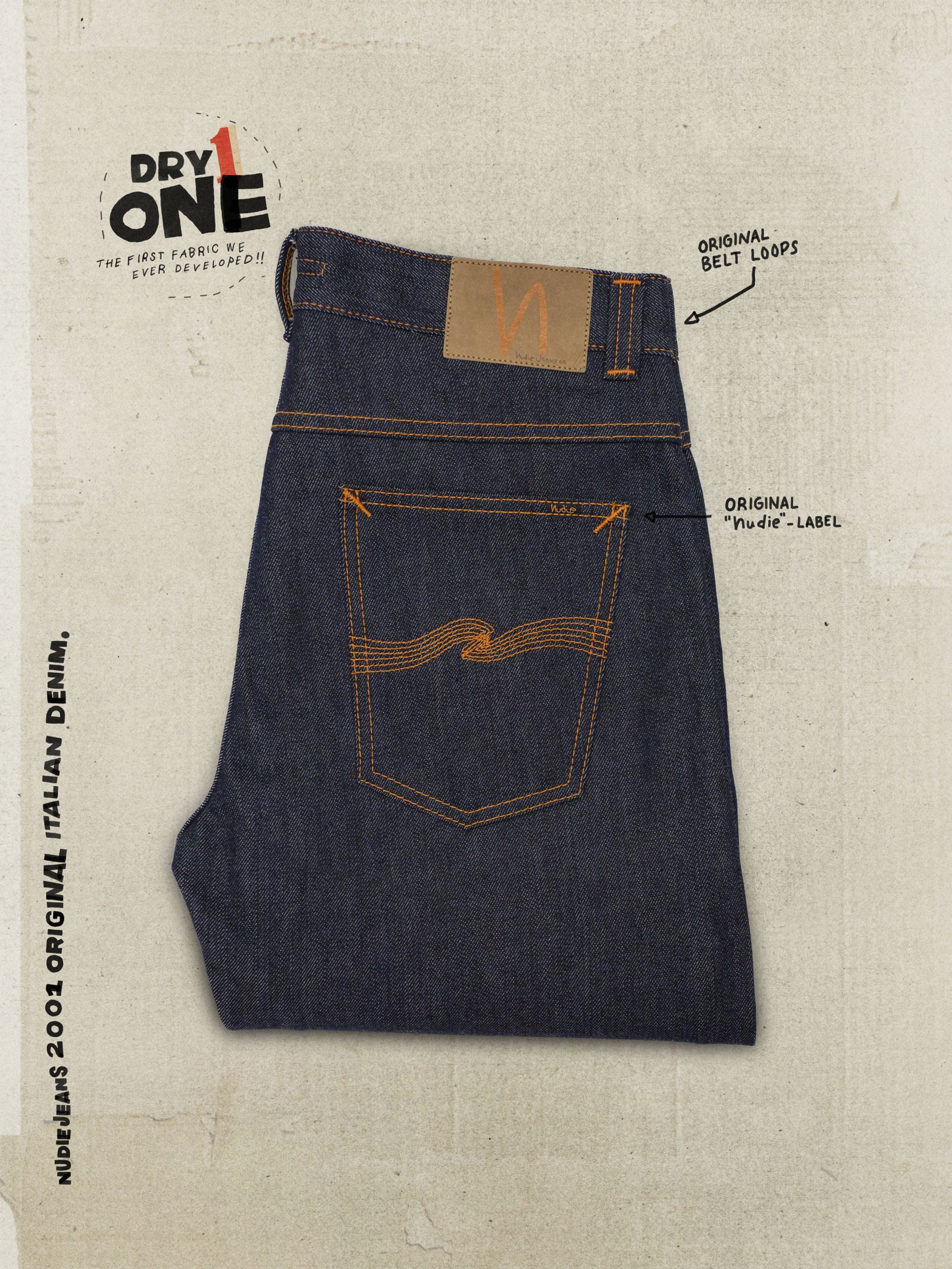 Nudie Jeans Regular Alf Dry One, back pocket of indigo rigid organic cotton denim jeans with signature orange embroidery.