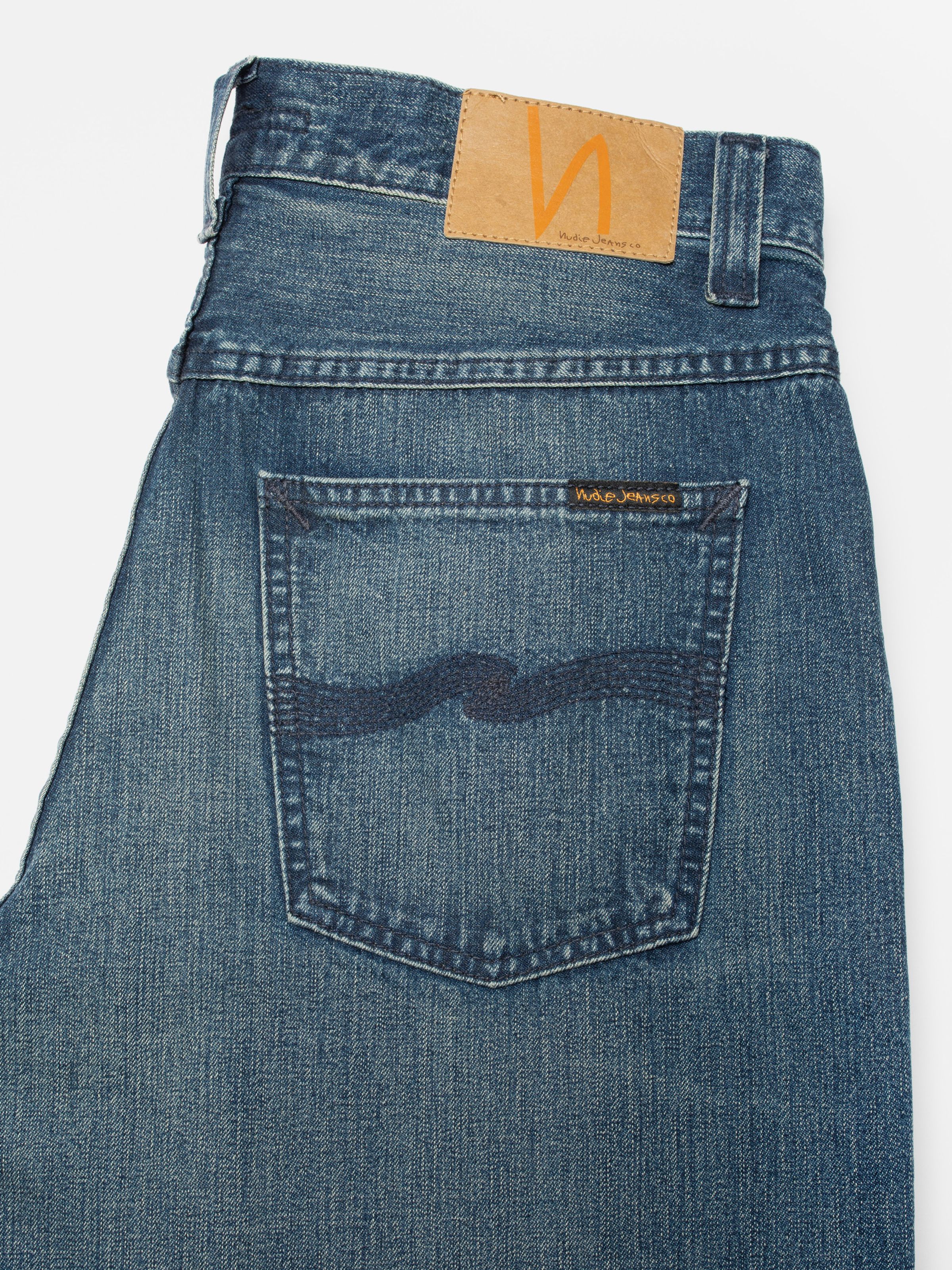Nudie Jeans Loud Larry Blue Painter, close-up of the back pocket with navy embroidery and jacron patch.