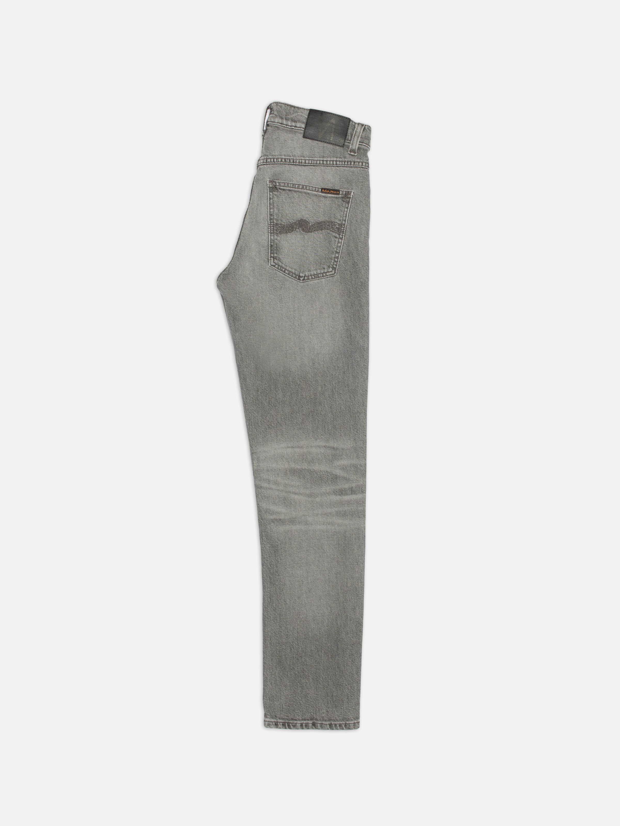 Nudie Jeans Solid Ollie Pale Ash, men's slim-fit jeans in a pale grey wash, shown from the side profile.