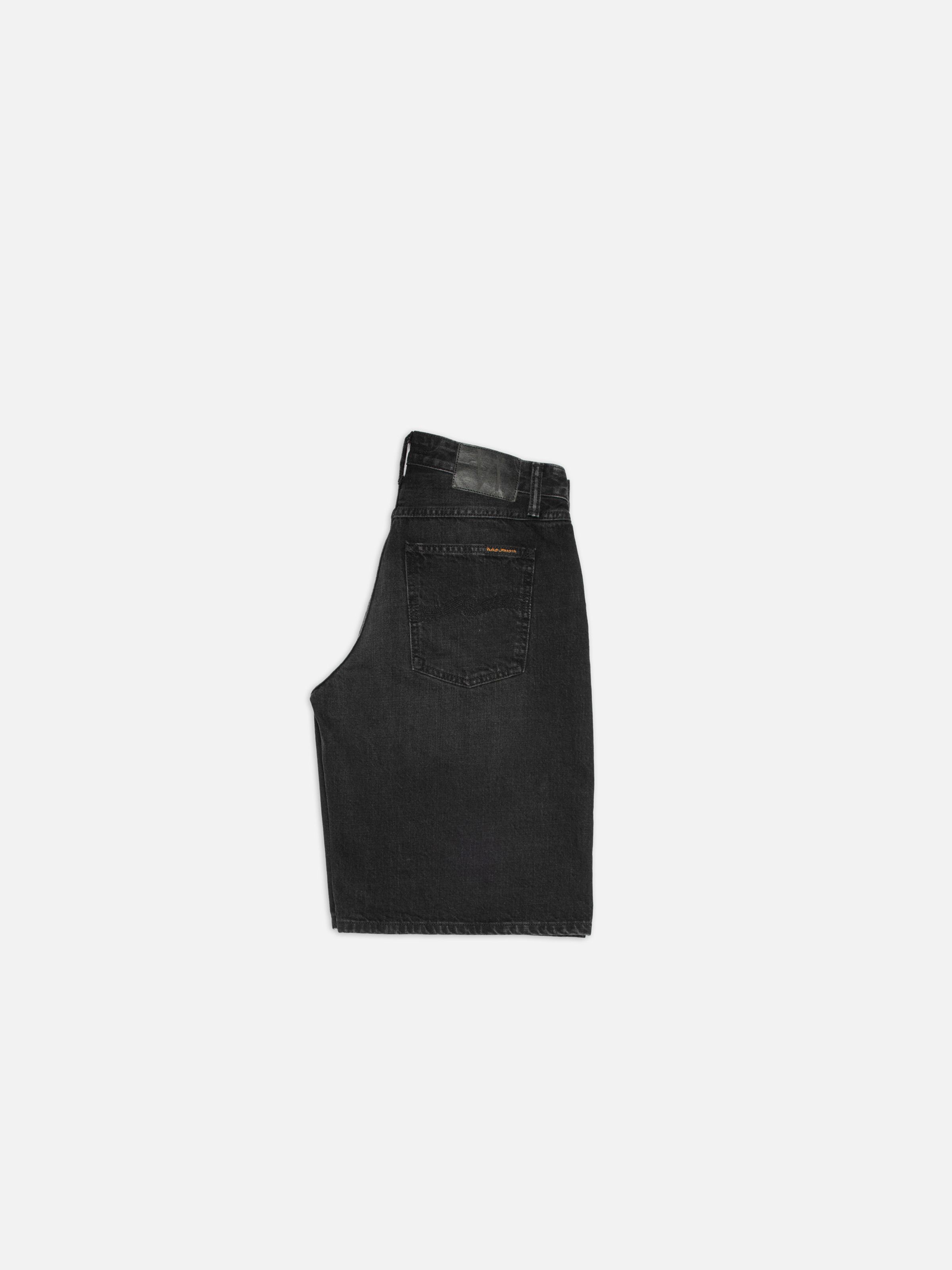 Nudie Jeans Meja Denim Shorts Night Dune, women's wide-leg black shorts shown from the back against a white background.