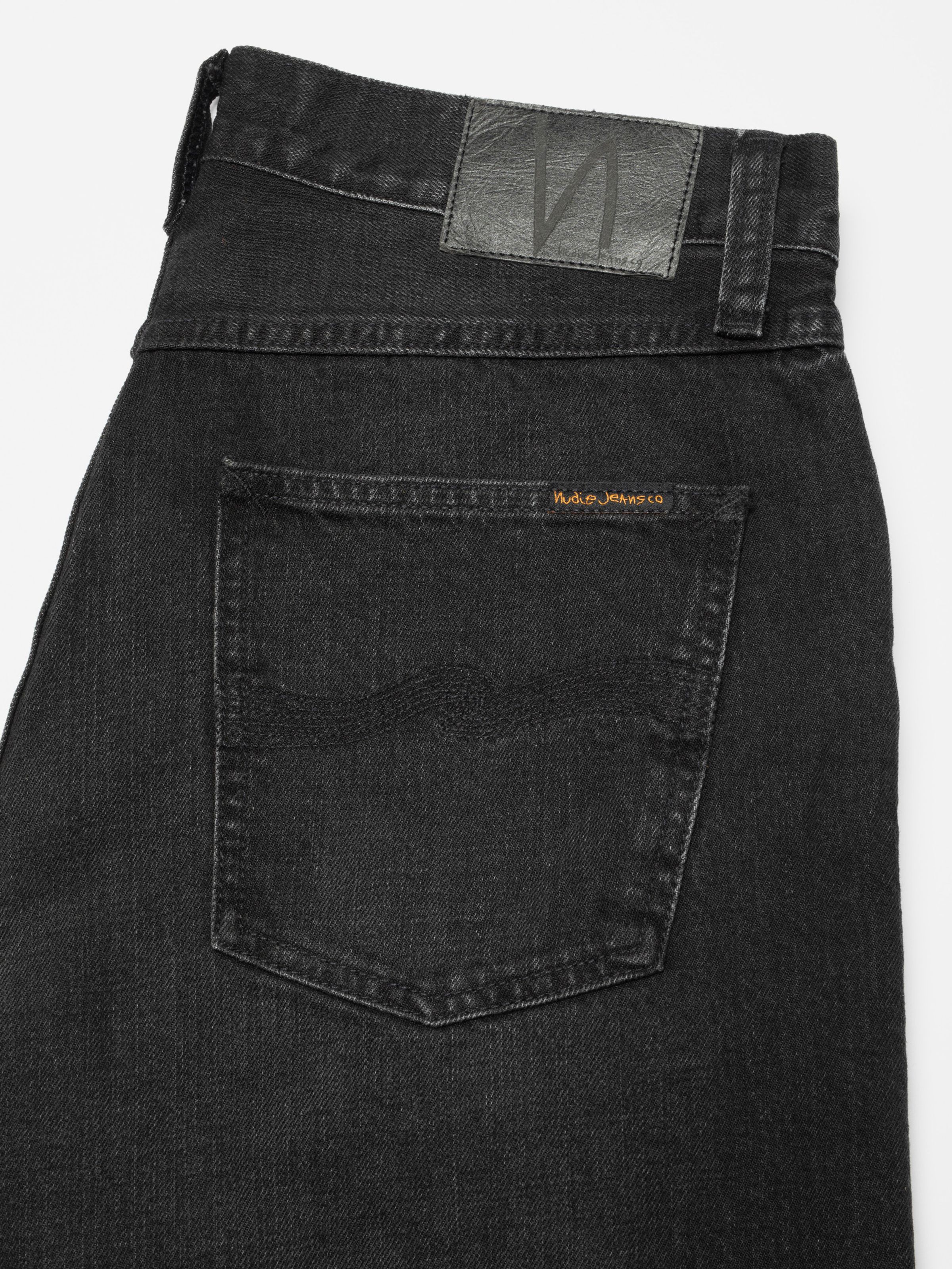 Nudie Jeans Seth Denim Shorts Night Dune, close-up of the back pocket showing the black stitching and waistband patch.