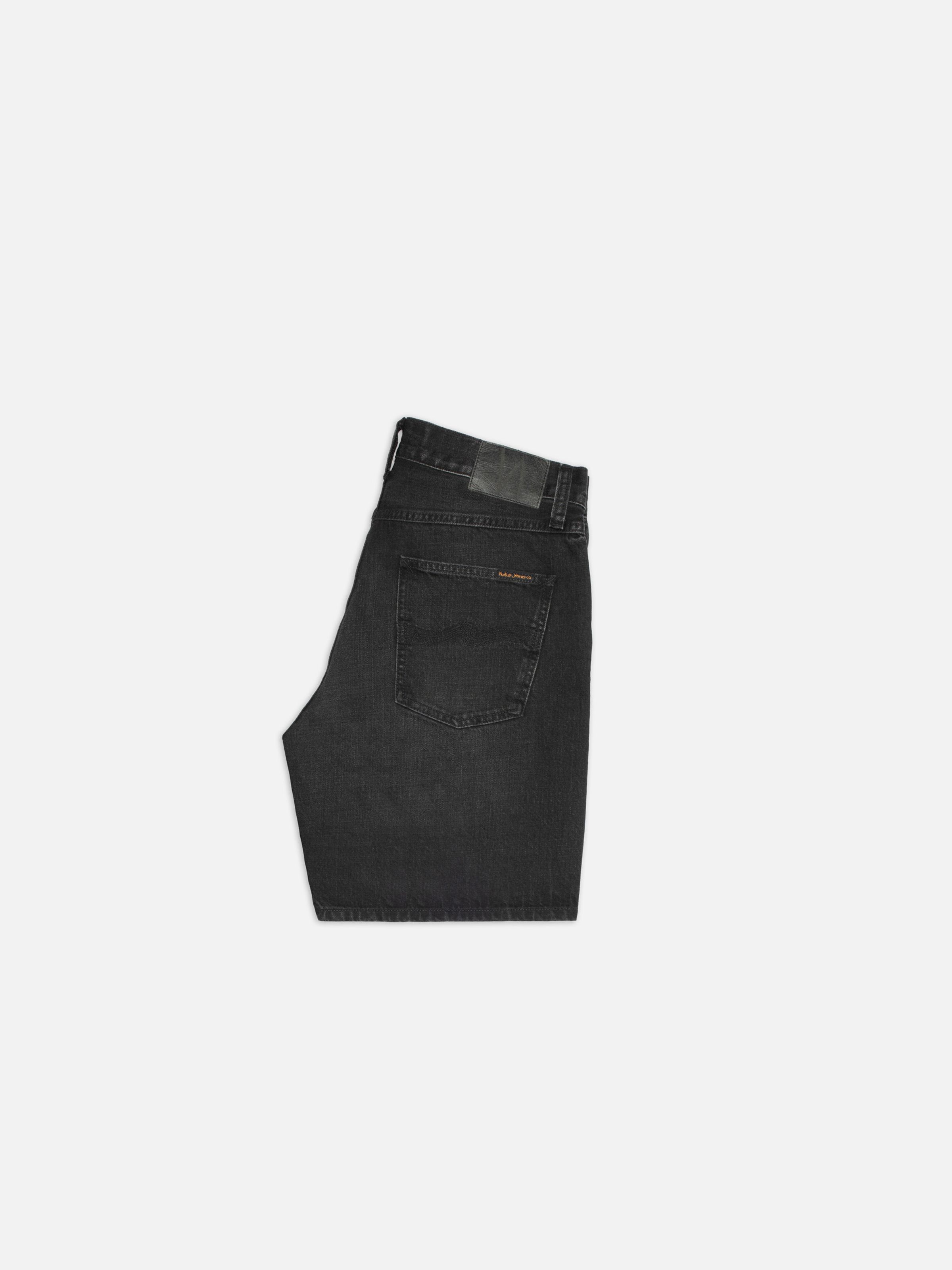 Nudie Jeans Seth Denim Shorts Night Dune, men's regular-fit black denim shorts shown from the side profile.