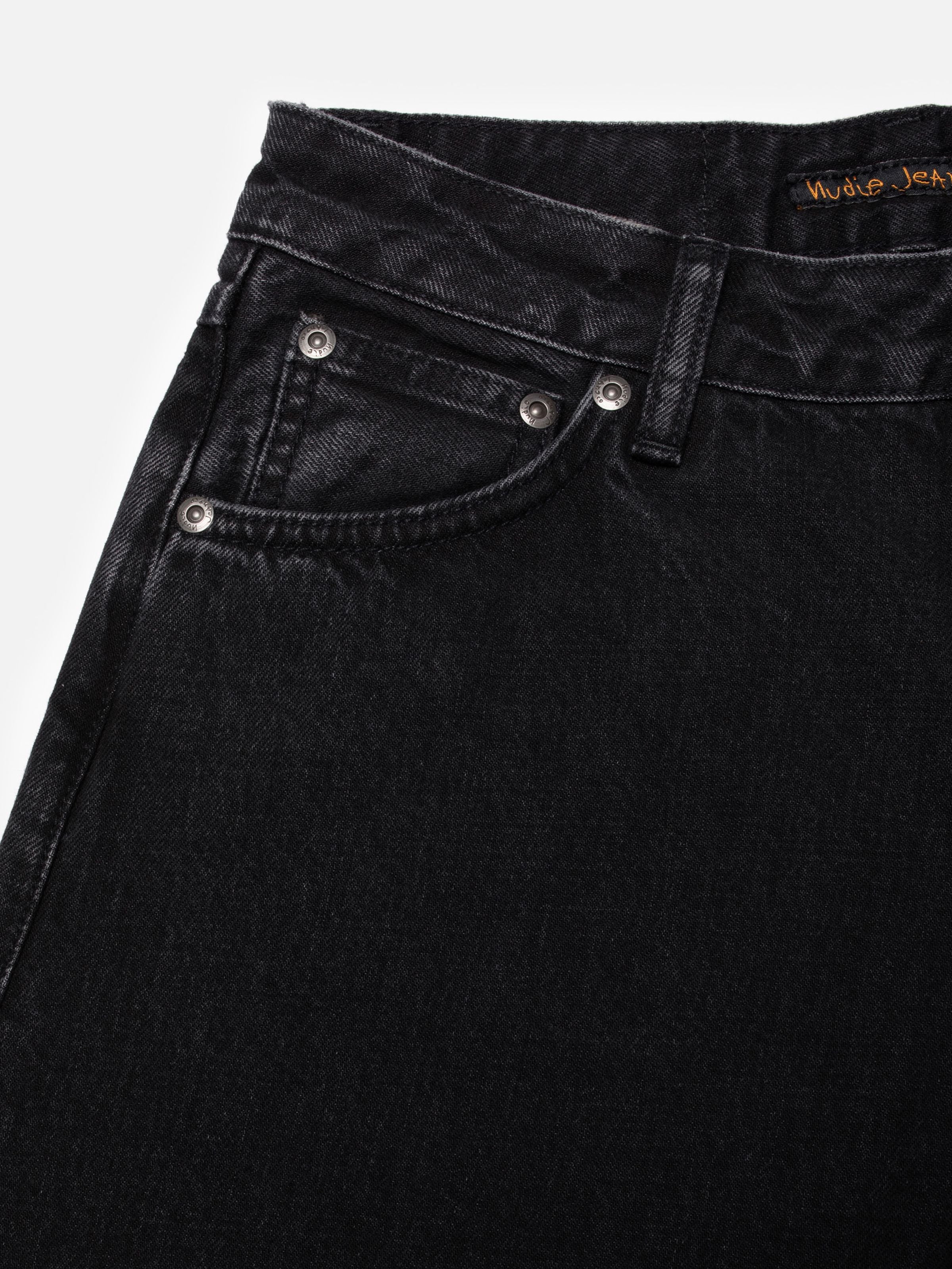 Nudie Jeans Sonic Sue Friendly Black, women's wide A-line leg jeans, with a close-up of the front pocket and waistband.