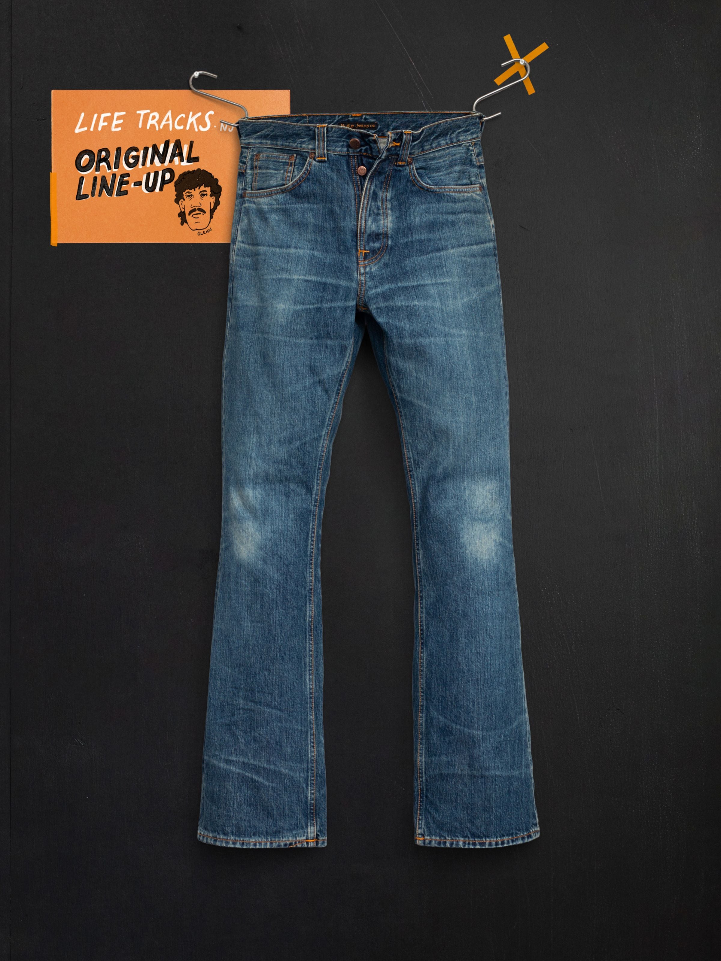 Nudie Jeans Flare Glenn Lineage Tracks, mid blue regular-fit jeans with a flared leg shown as a flatshot.