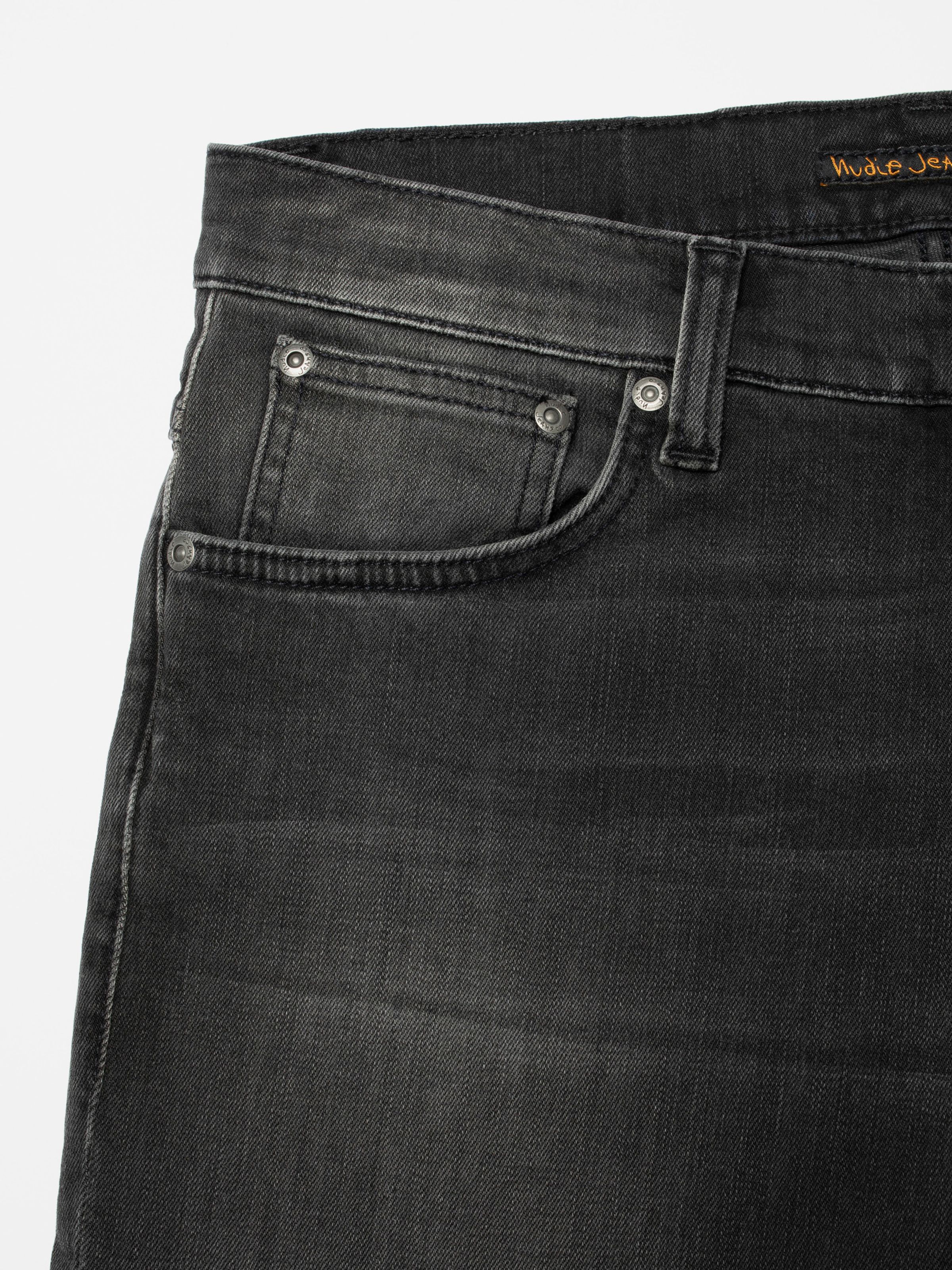Nudie Jeans Grim Tim Black Mist, men's slim fit jeans, close-up of the front pocket.