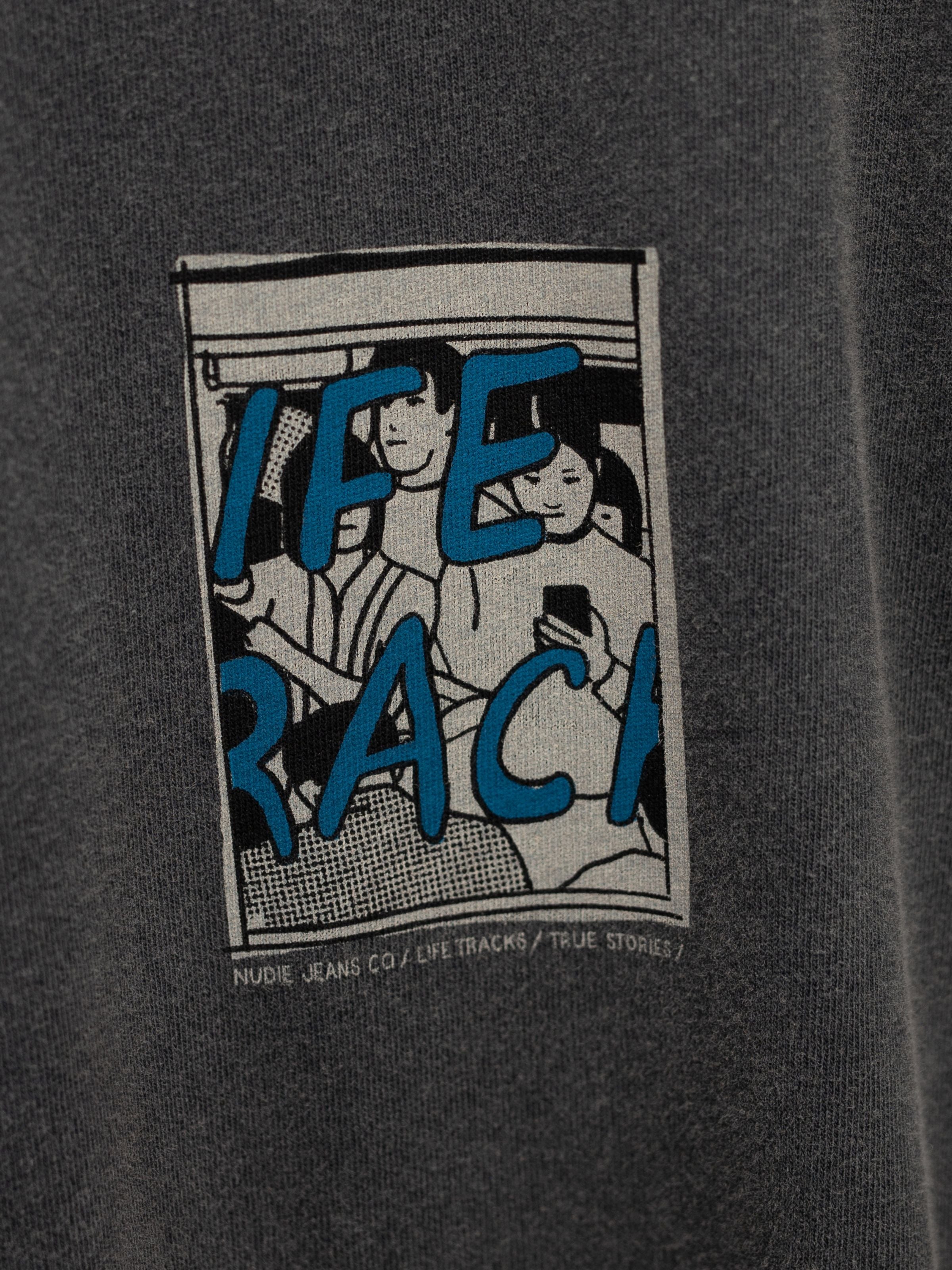 Nudie Jeans Koffe T-Shirt LifeTracks III Antracite, a close-up of the illustrative graphic print on organic cotton.