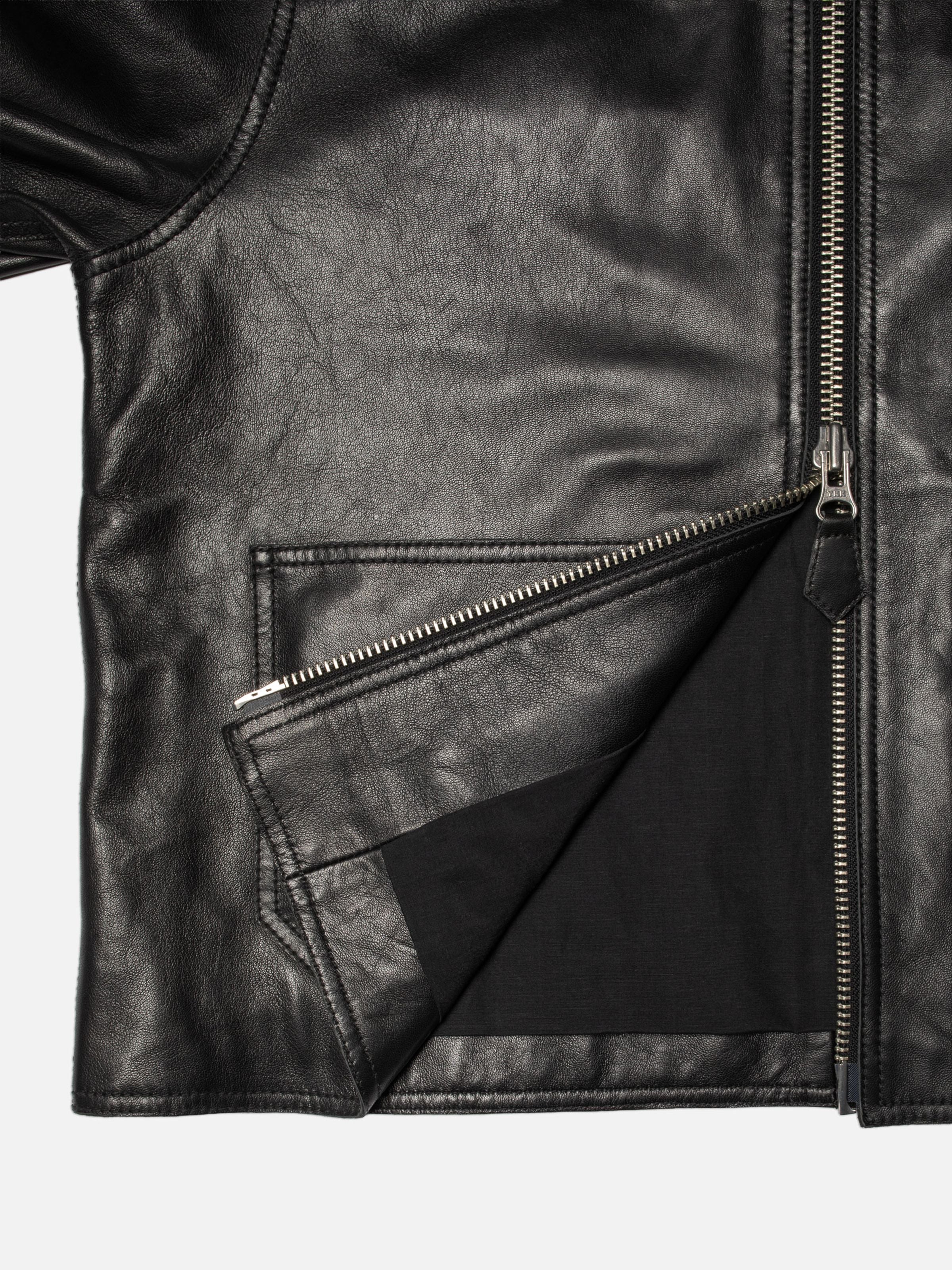 Nudie Jeans Anja Zip Jacket Leather Black, close-up of the two-way metal zipper and organic cotton blend lining.
