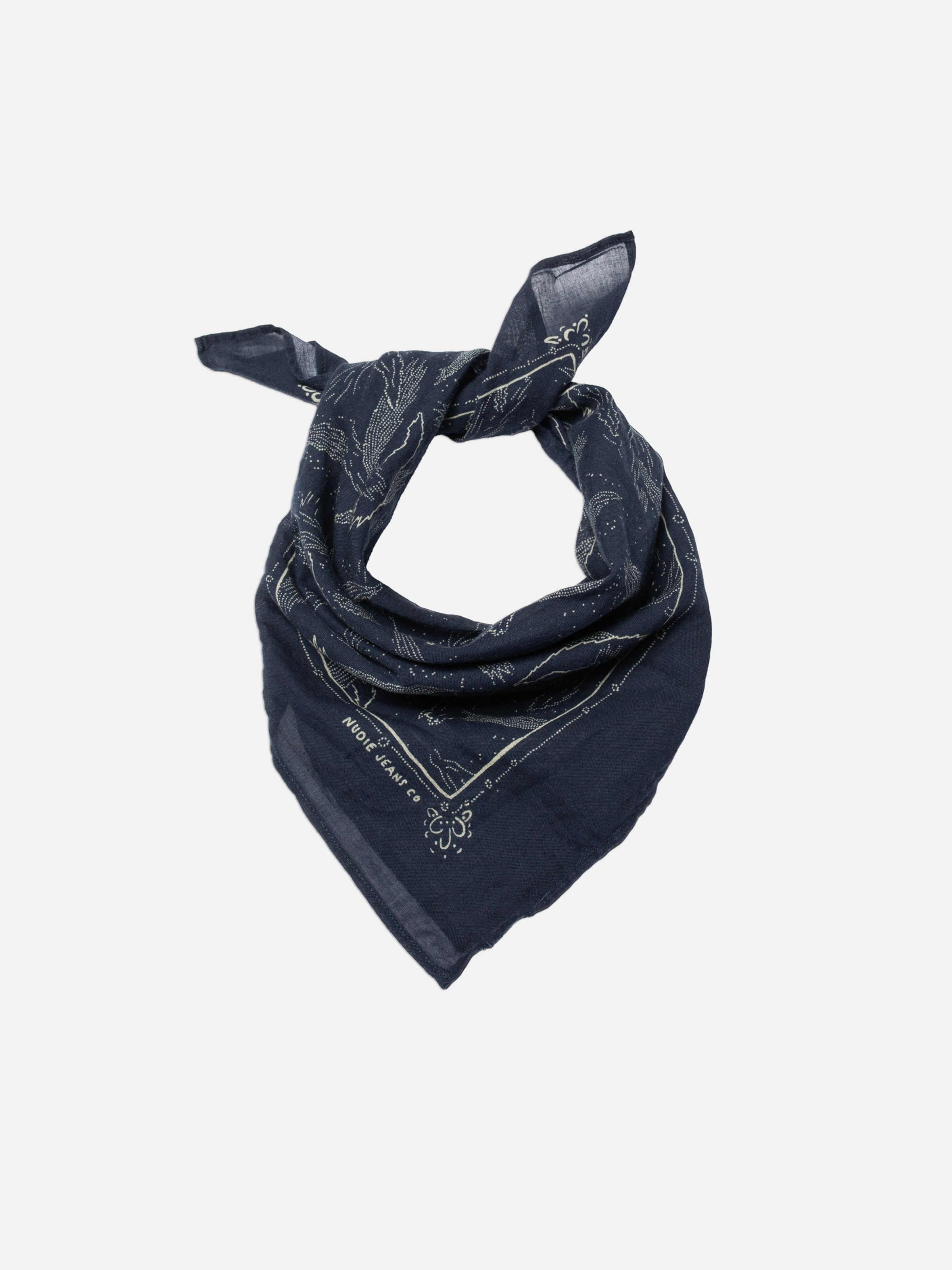 Nudie Jeans Ingrid Bandana Starburst Blue, a blue organic cotton bandana with a starburst print, shown tied in a flatshot.