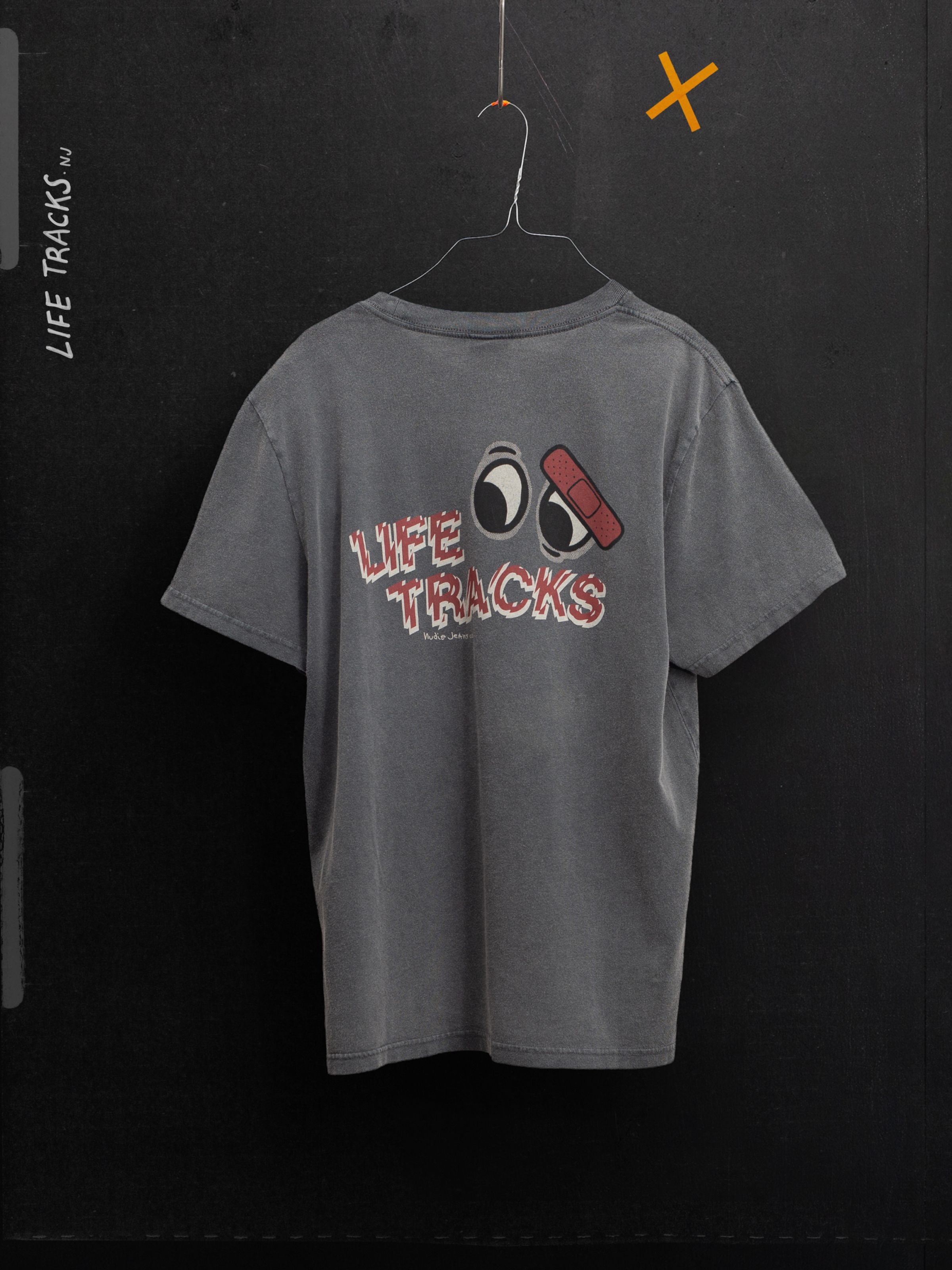 Nudie Jeans Roy T-Shirt Life Tracks I Antracite, showing the graphic back print on a faded organic cotton crew neck tee.