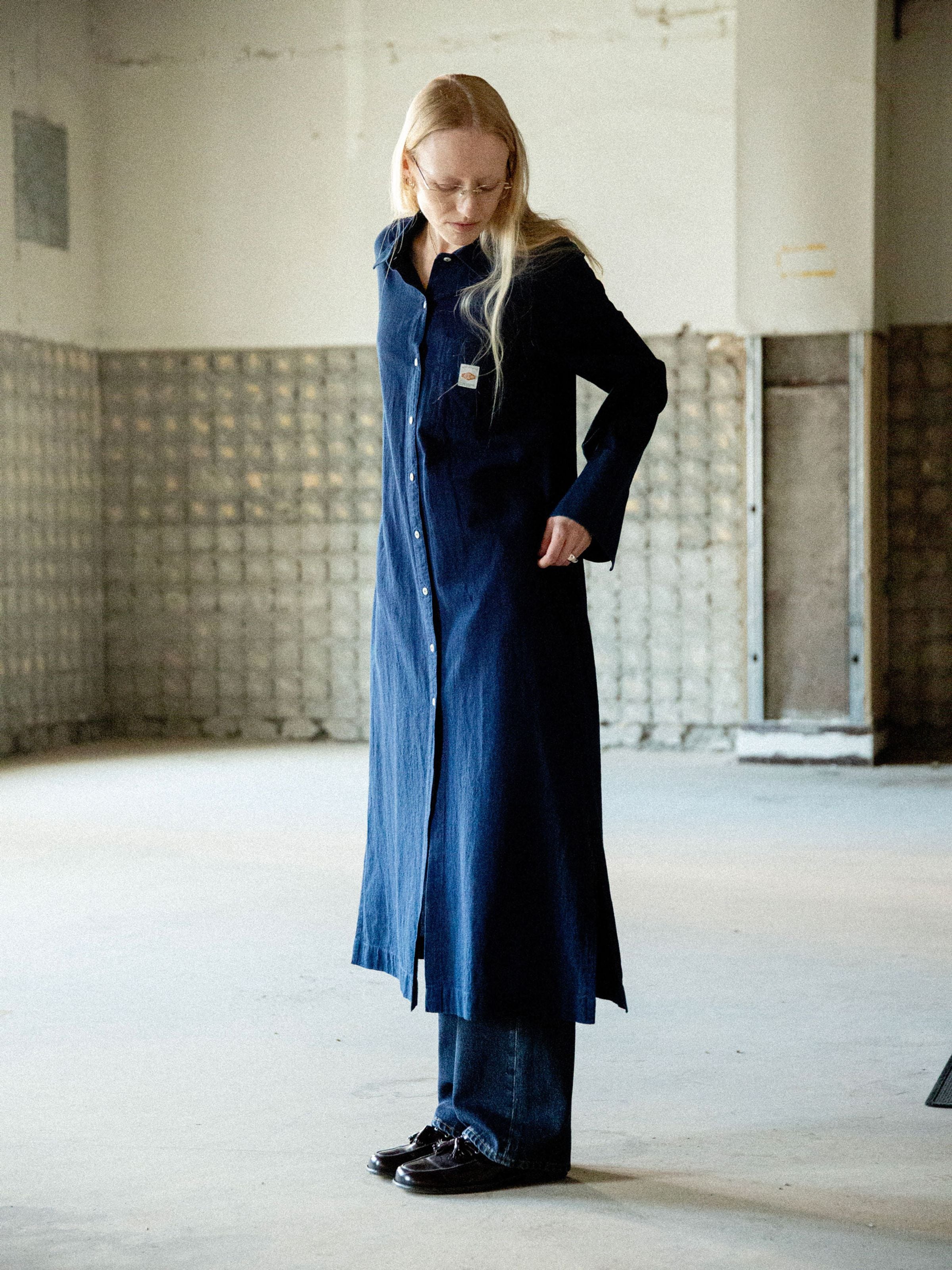 Nudie Jeans Nila Shirt Dress in Indigo Blue, a relaxed fit organic cotton and organic linen dress shown on a model.