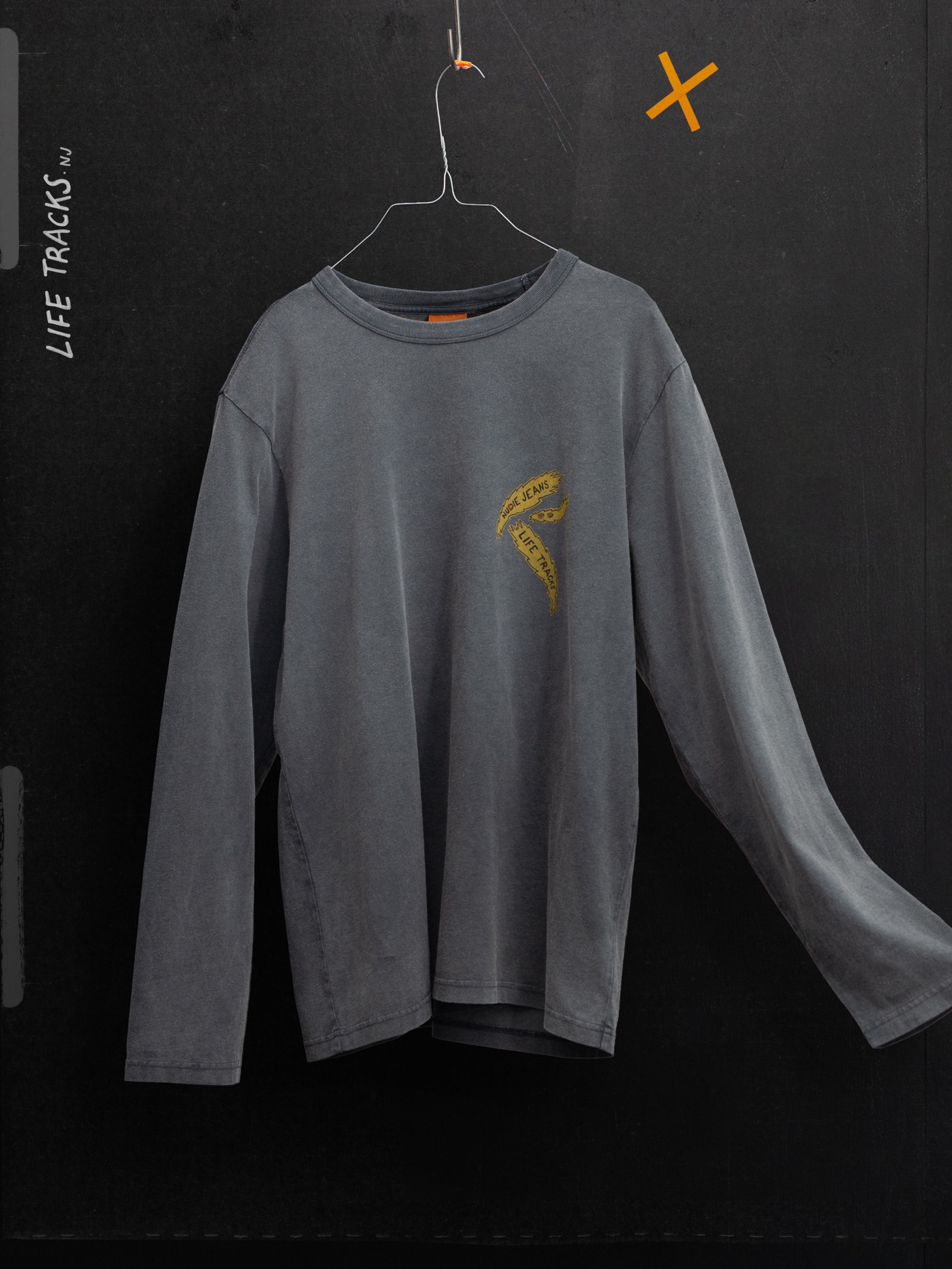 Rudi Long Sleeve T-Shirt Life Tracks II Antracite, a faded organic cotton tee with yellow chest print, hanging on a wire.